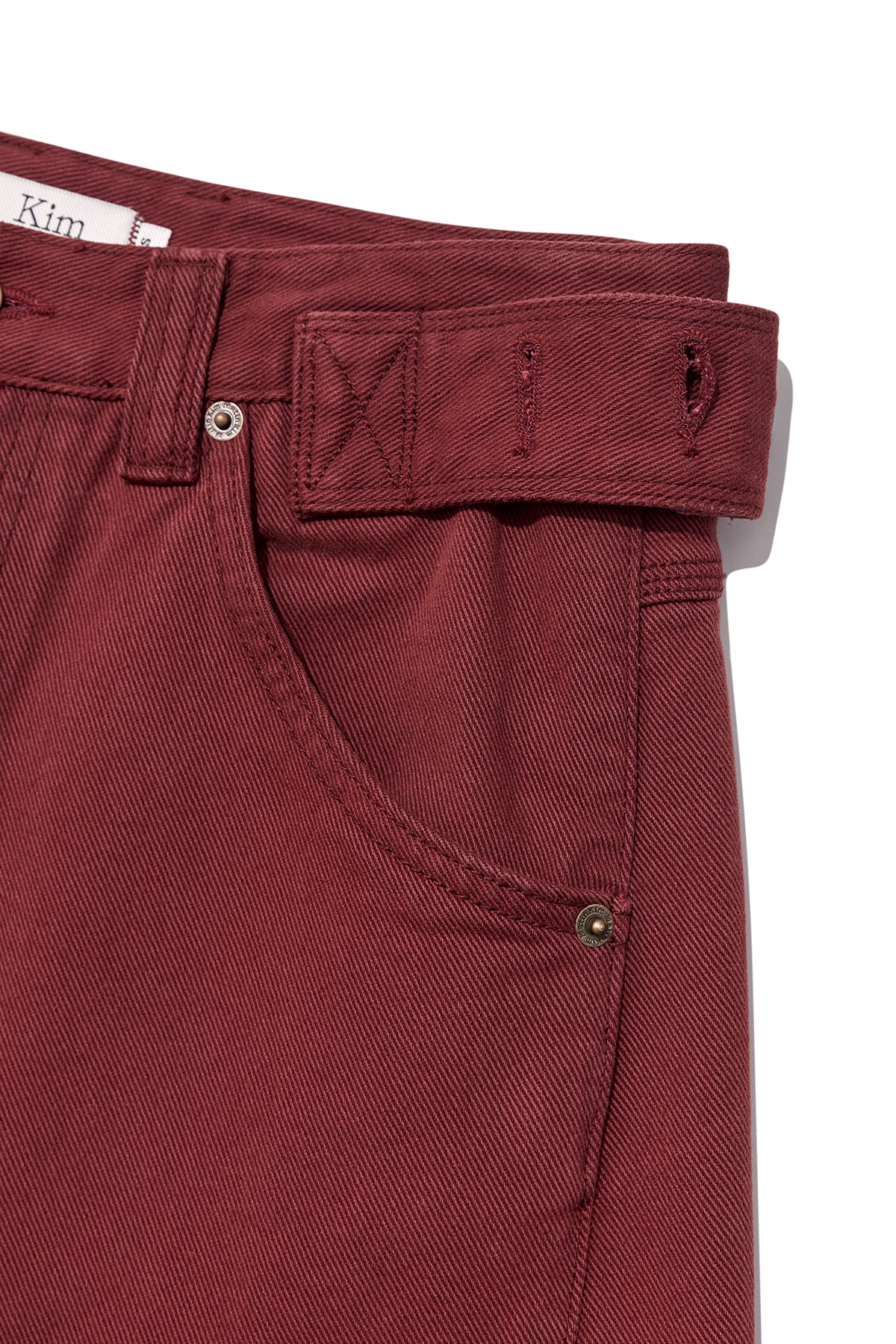 matinkim WAIST BUCKLE CURVED DYING DENIM PANTS IN RED