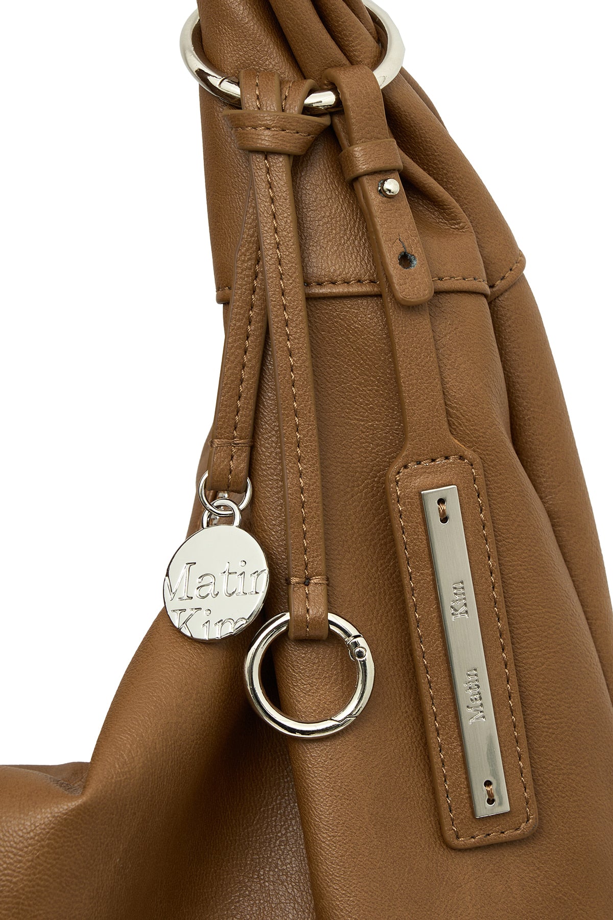 matinkim TWIST HANDLE SMALL HOBO BAG IN BROWN