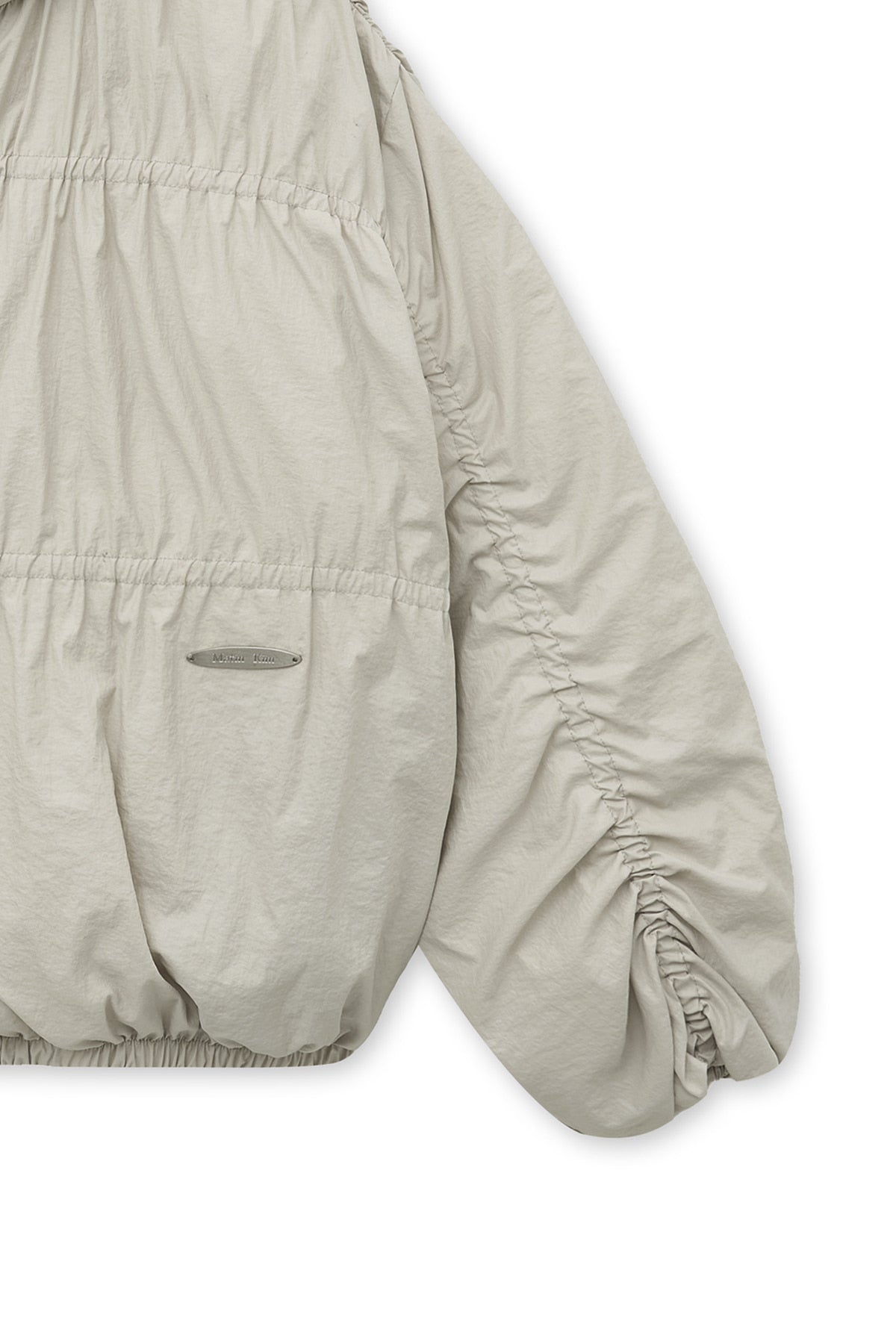 matinkim HIGH NECK SHIRRING DOWN JUMPER IN LIGHT BEIGE