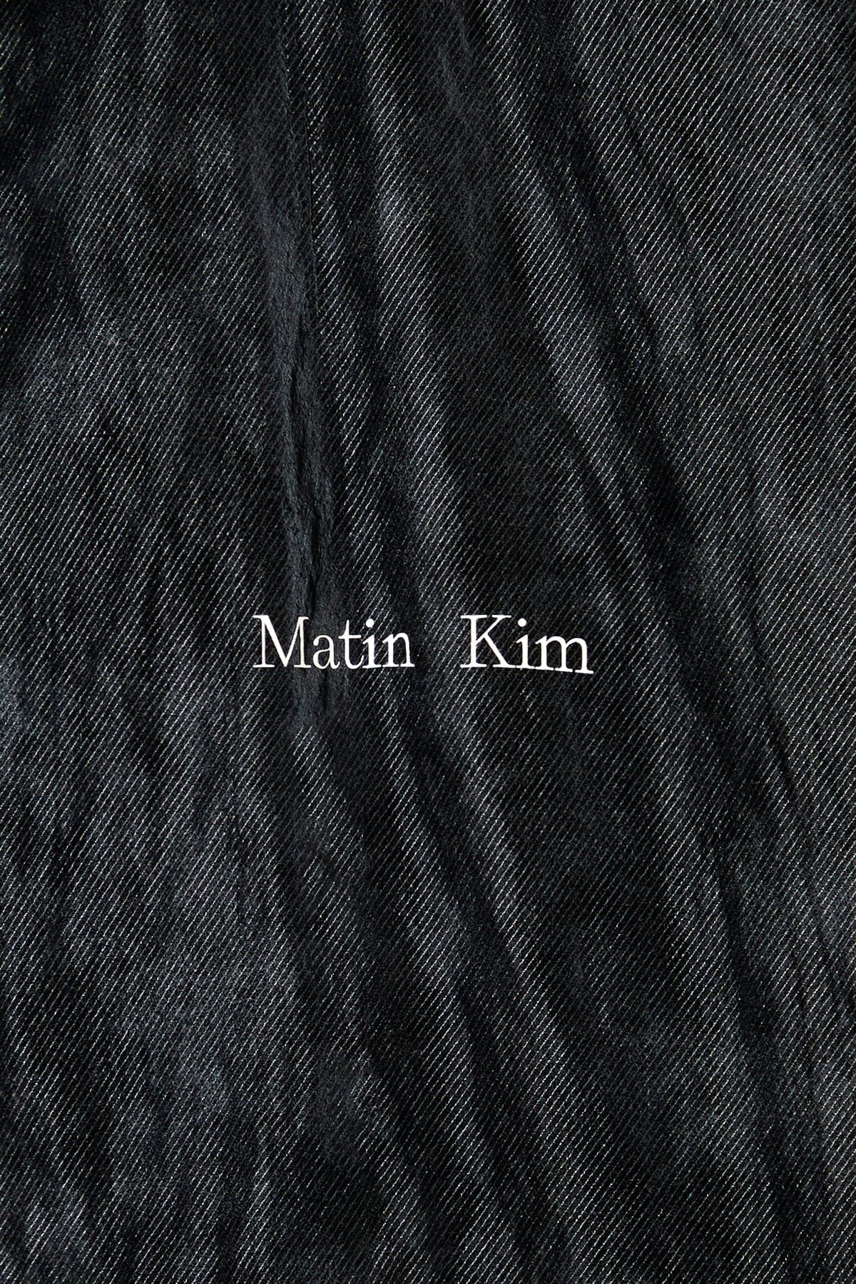 matinkim STITCH POINT HIGH NECK JUMPER IN BLACK