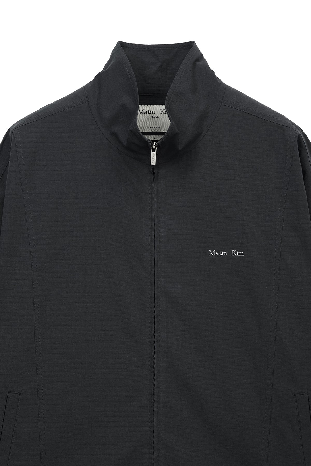 matinkim BACK LOGO HIGH NECK JUMPER IN CHARCOAL
