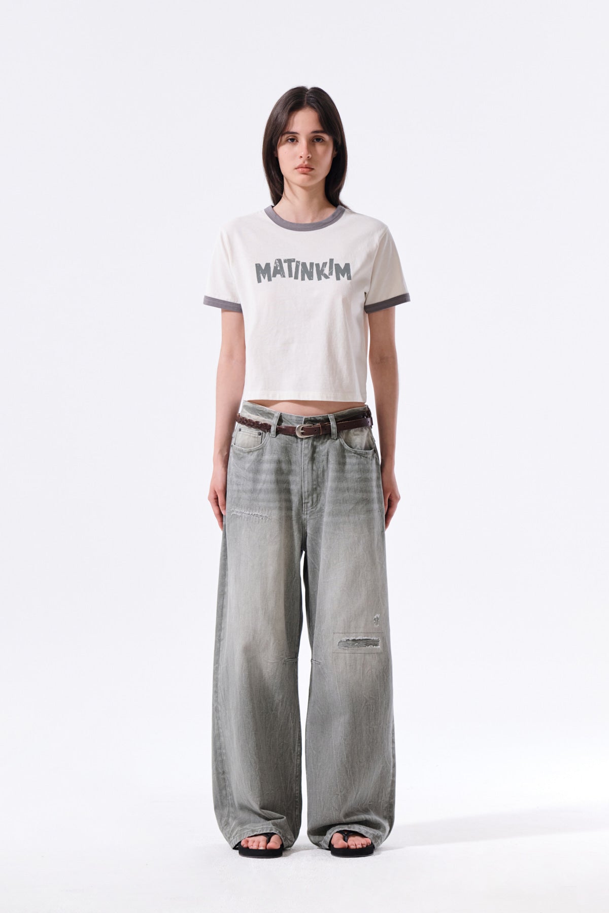 matinkim BACK LOGO WASHED DENIM PANTS IN KHAKI