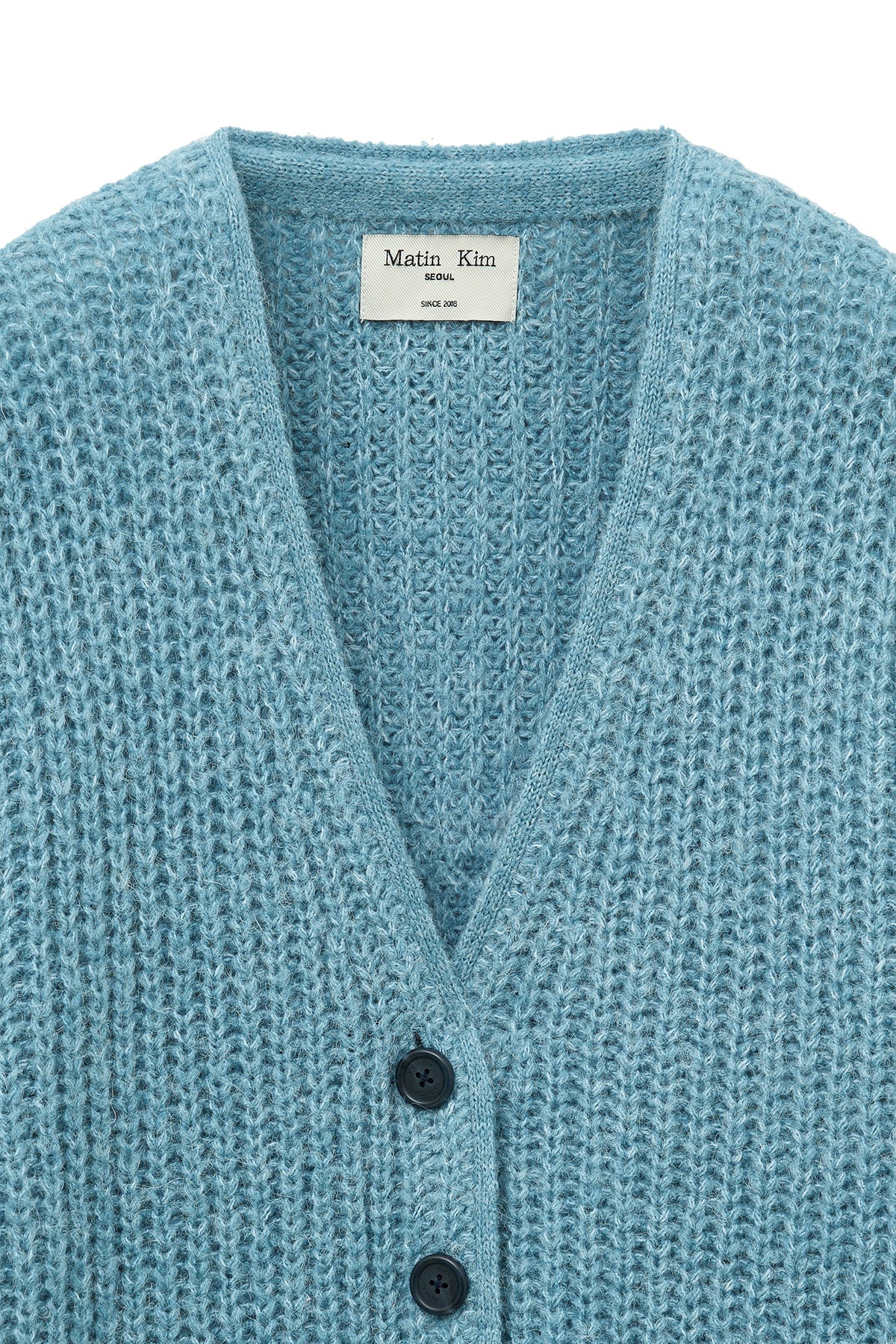 matinkim SIDE BUTTON POINT OVERFIT CARDIGAN IN LIGHT BLUE