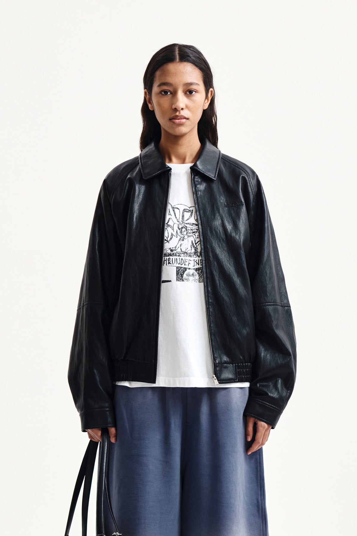 matinkim SMALL LOGO FAUX LEATHER ZIP UP JUMPER IN BLACK
