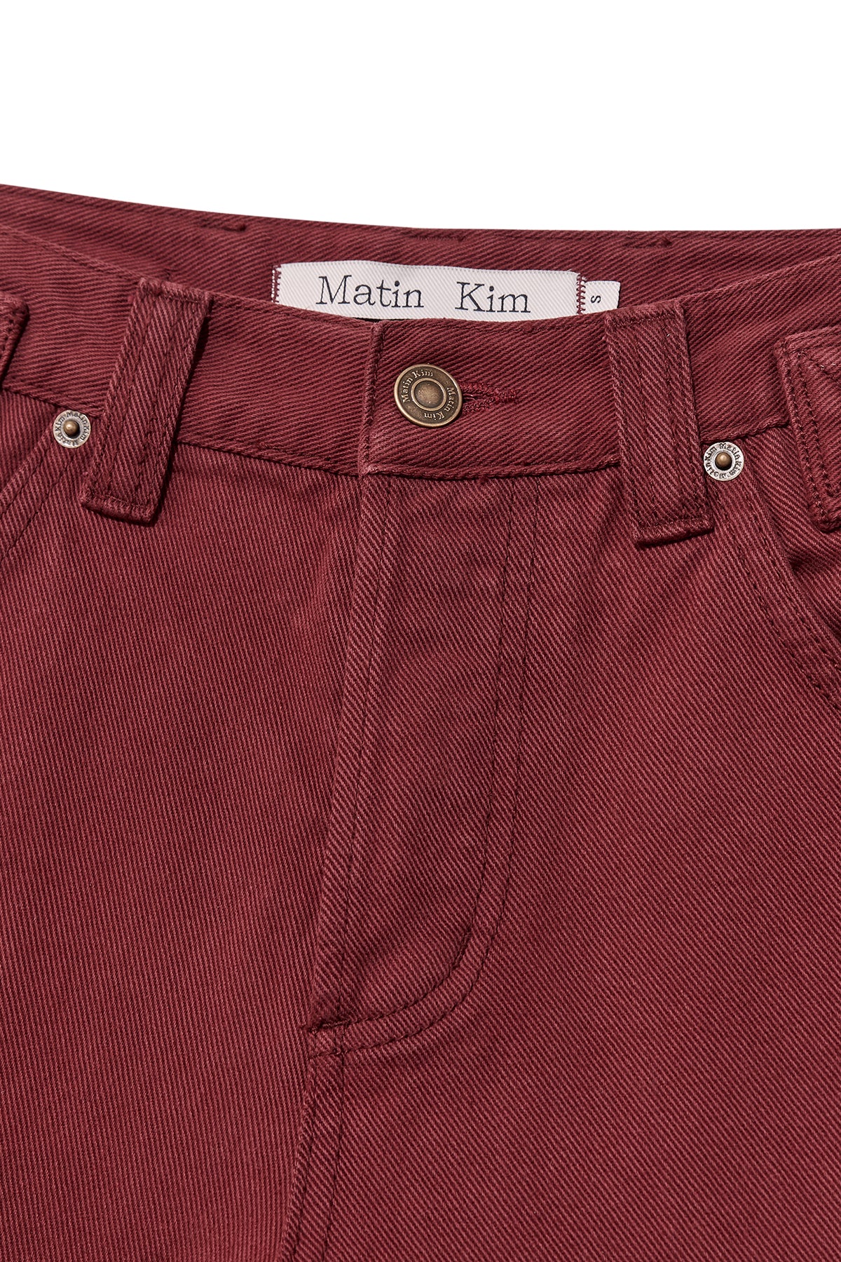 matinkim WAIST BUCKLE CURVED DYING DENIM PANTS IN RED