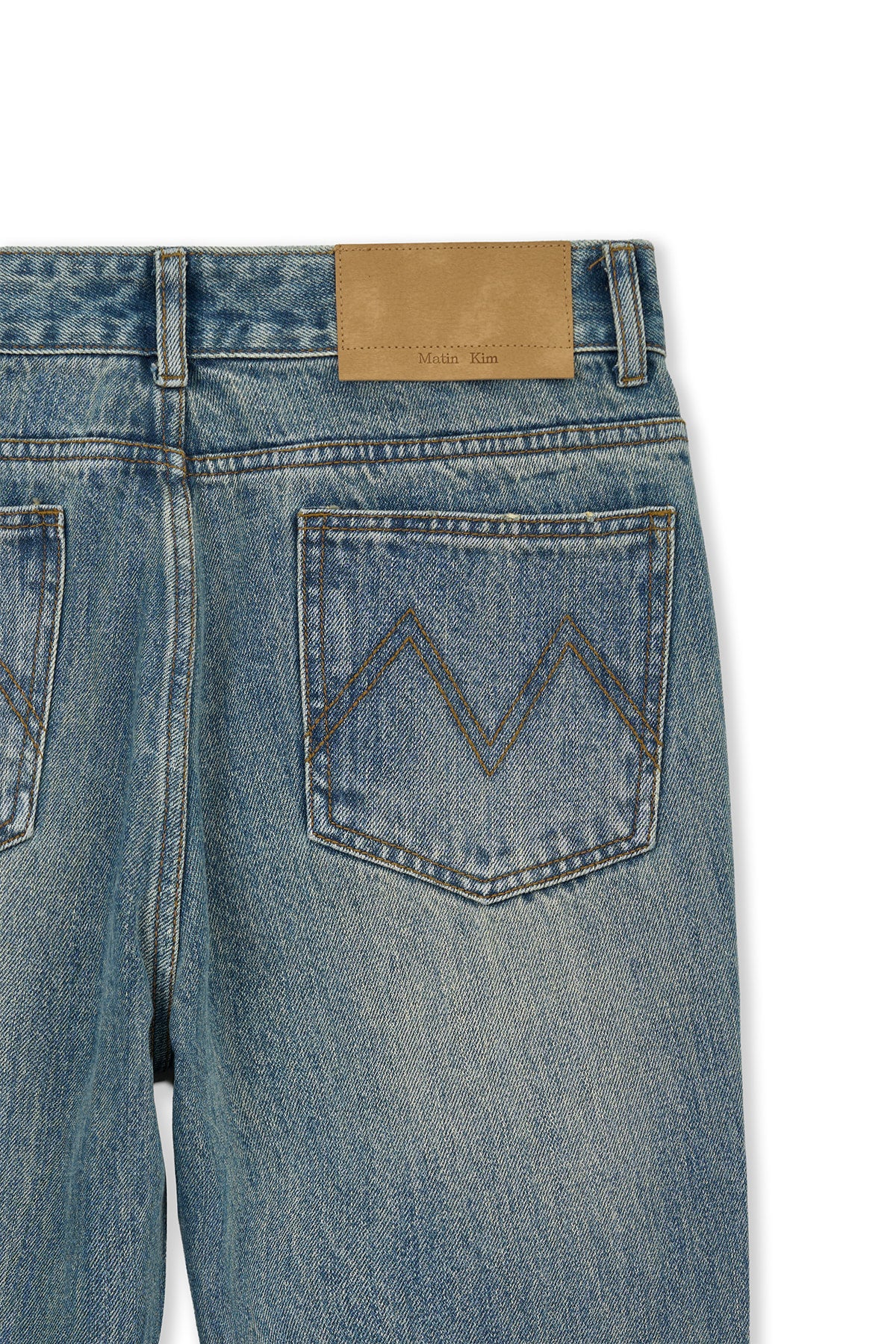 matinkim WASHED POINT BOOTS CUT DENIM PANTS IN BLUE