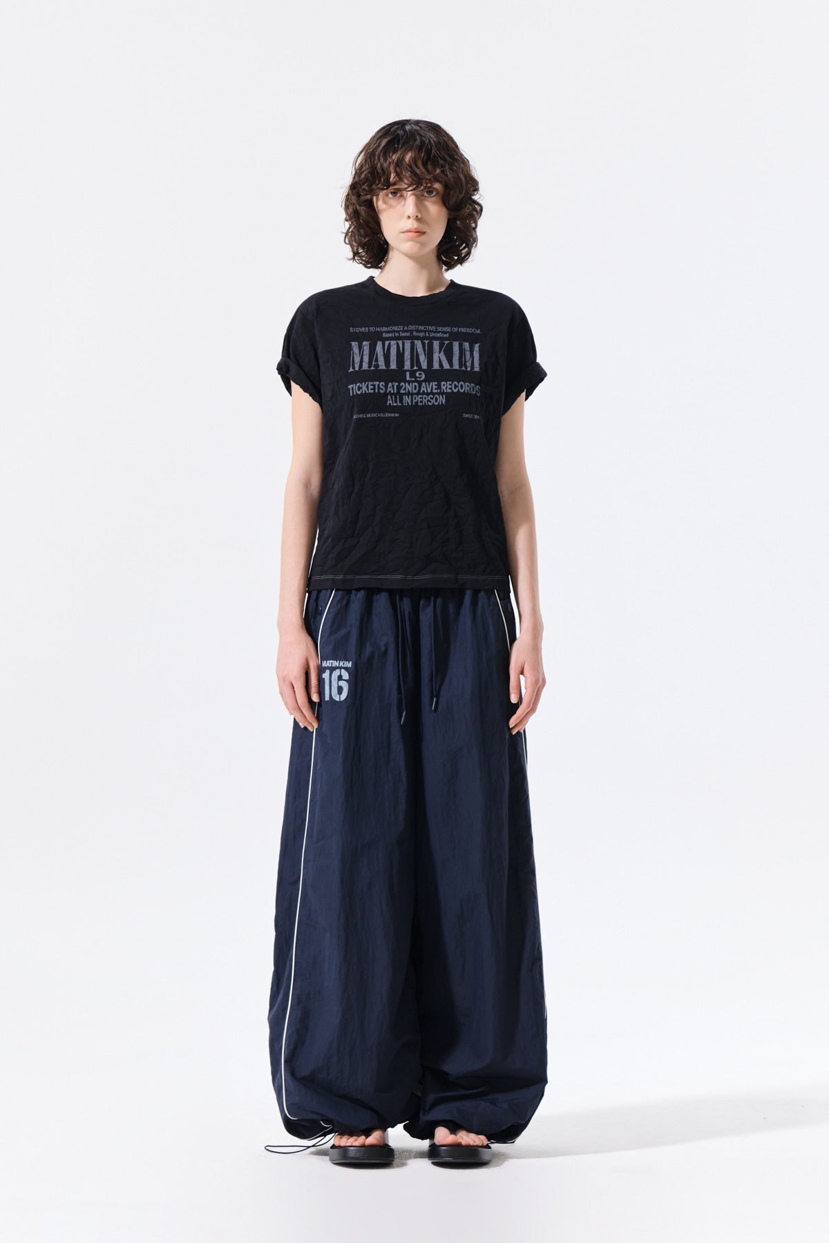 matinkim MATIN 16 LOGO TRACK PANTS IN NAVY
