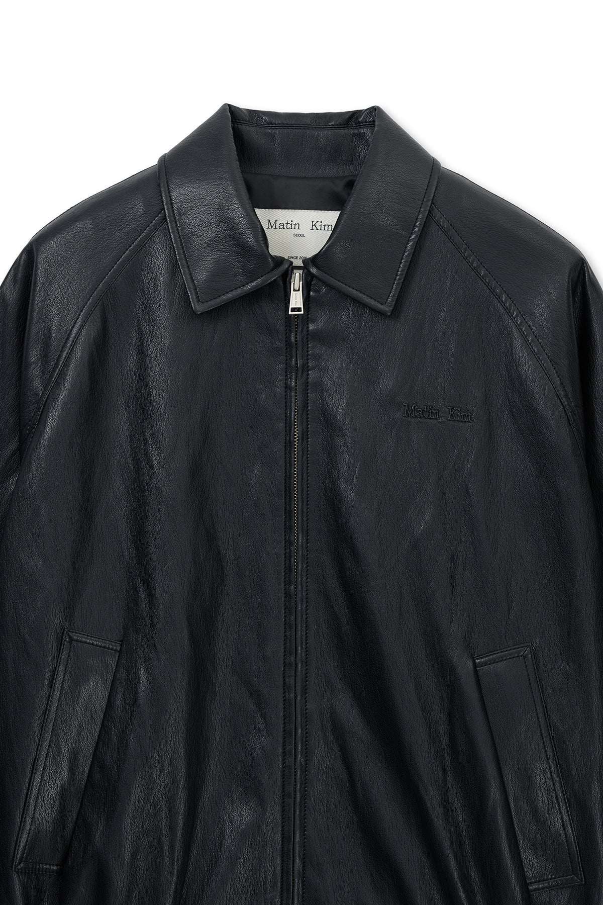 matinkim SMALL LOGO FAUX LEATHER ZIP UP JUMPER IN BLACK