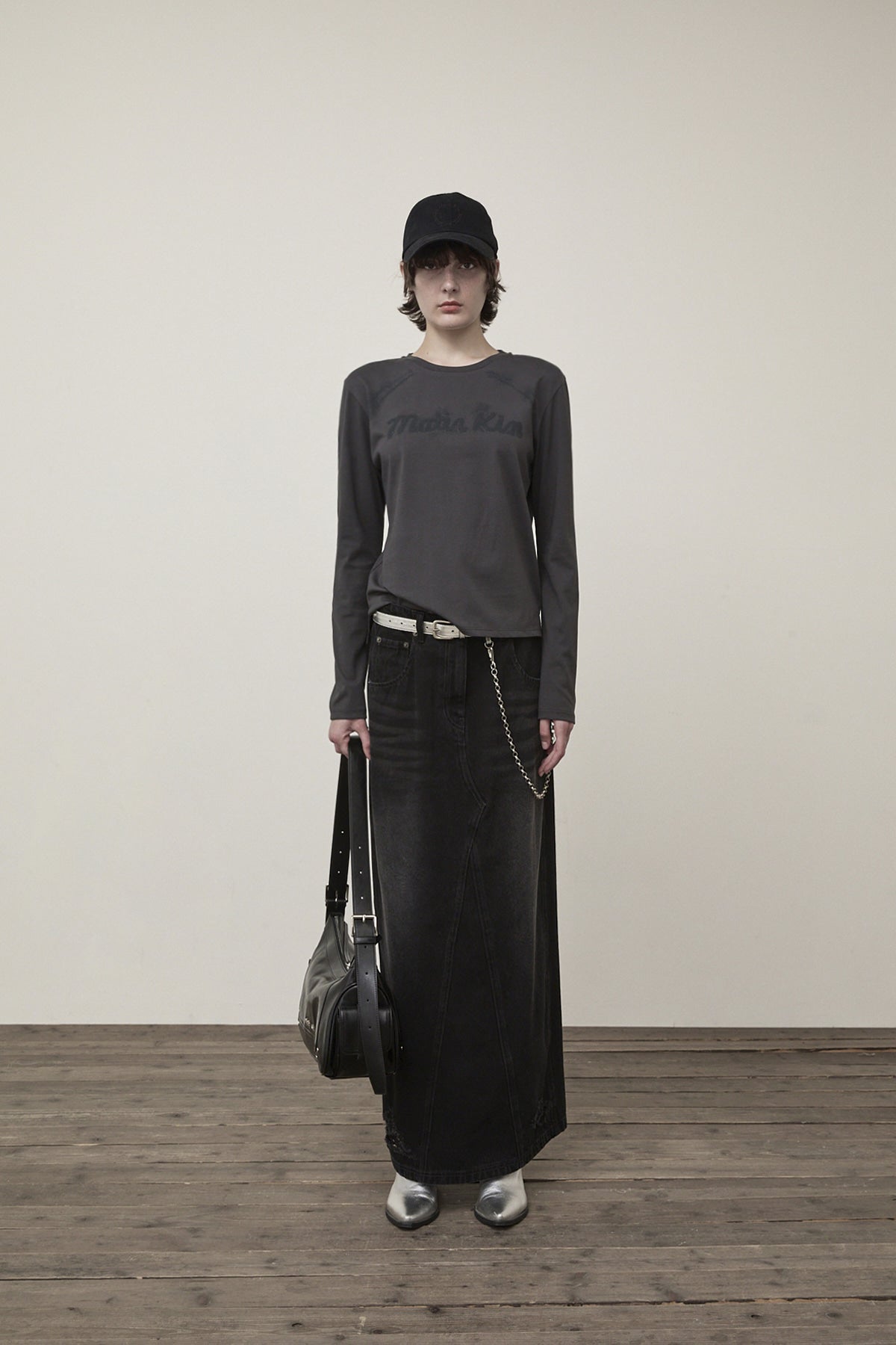 matinkim DAMAGE POINT LONG DENIM SKIRT IN BLACK