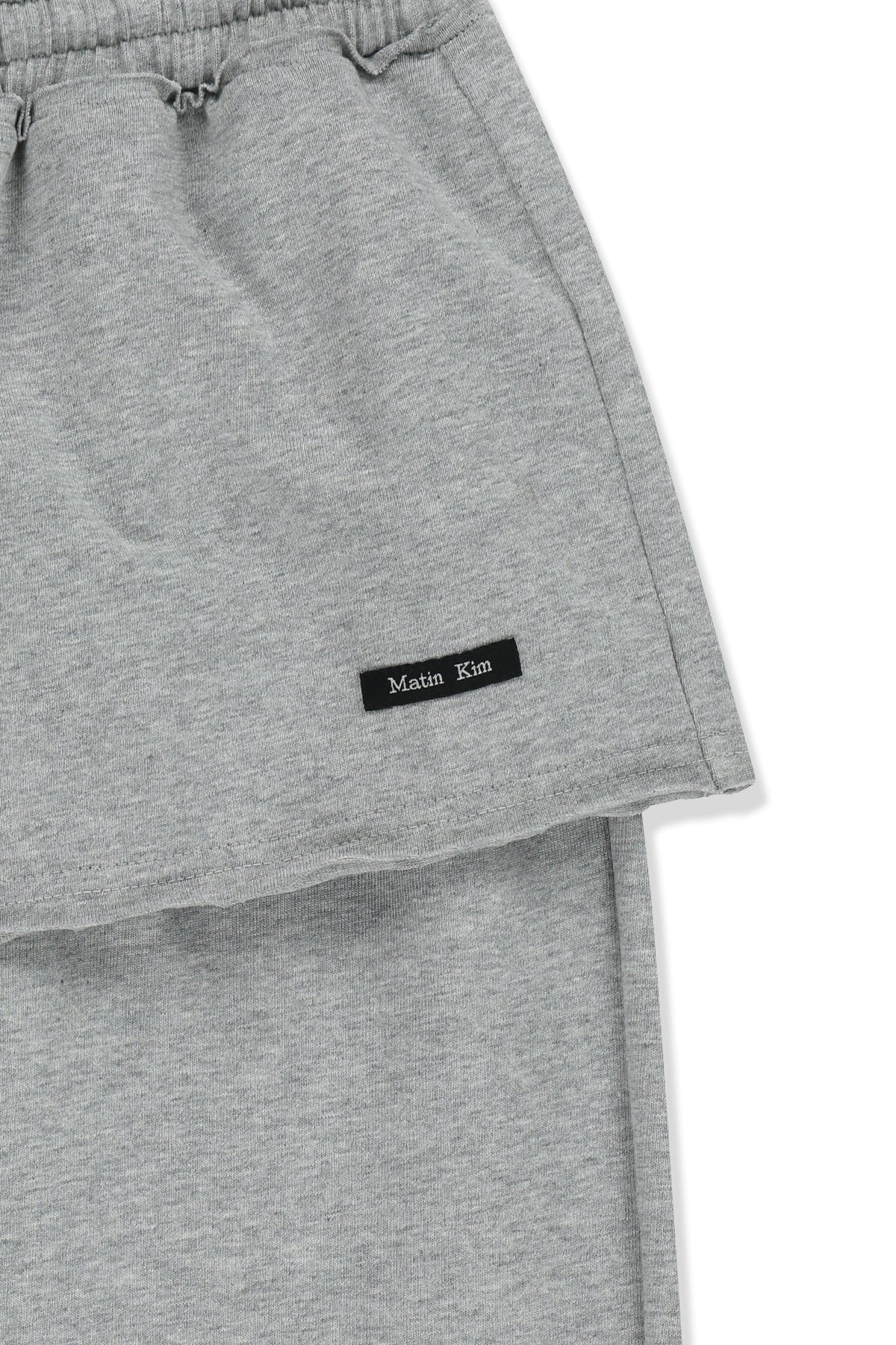 matinkim LAYERED SKIRT JERSEY PANTS IN GREY