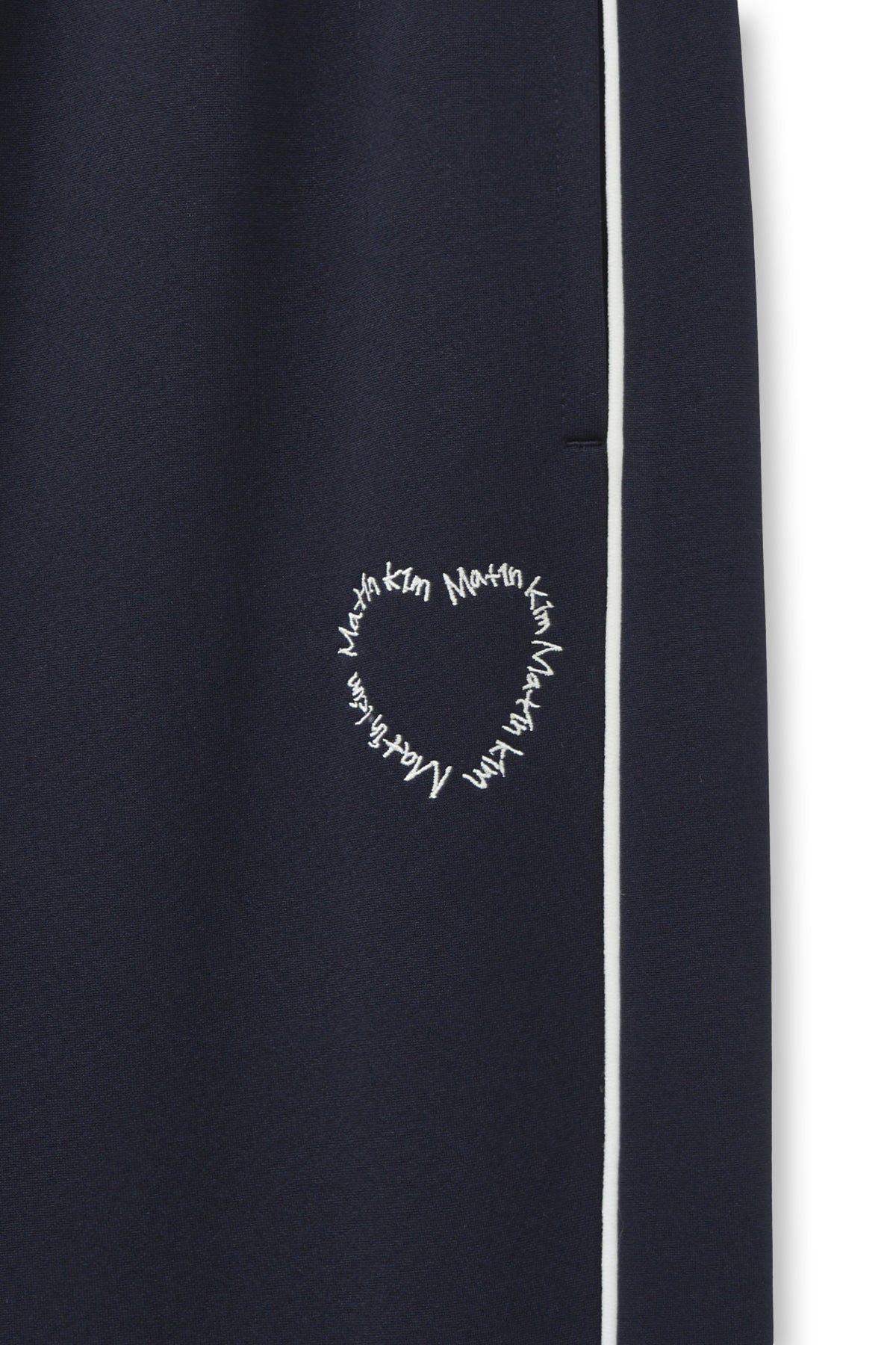 matinkim HEART LOGO TRACK PANTS IN NAVY
