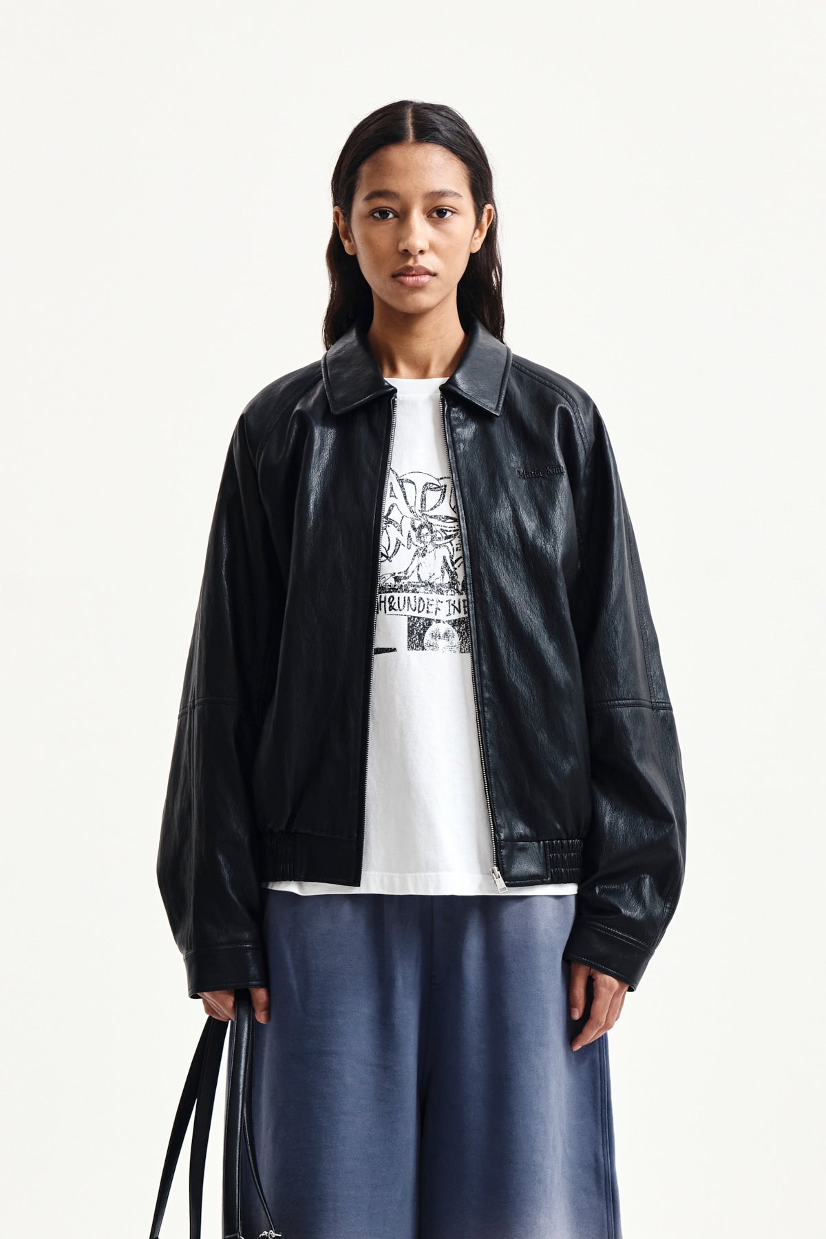 matinkim SMALL LOGO QUILTED FAUX LEATHER ZIP UP JUMPER IN BLACK