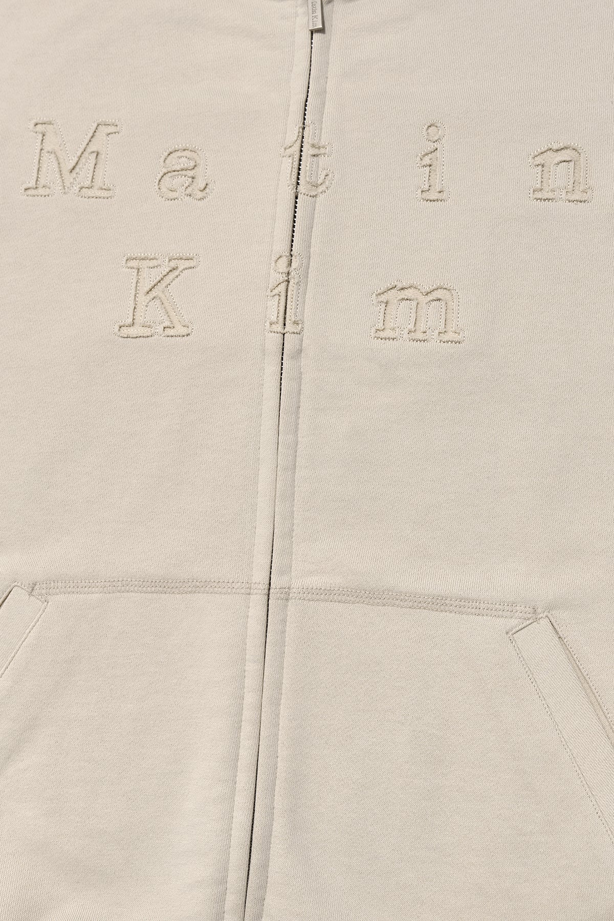 matinkim APPLIQUE CUTTED LOGO HOODY ZIP UP IN BEIGE