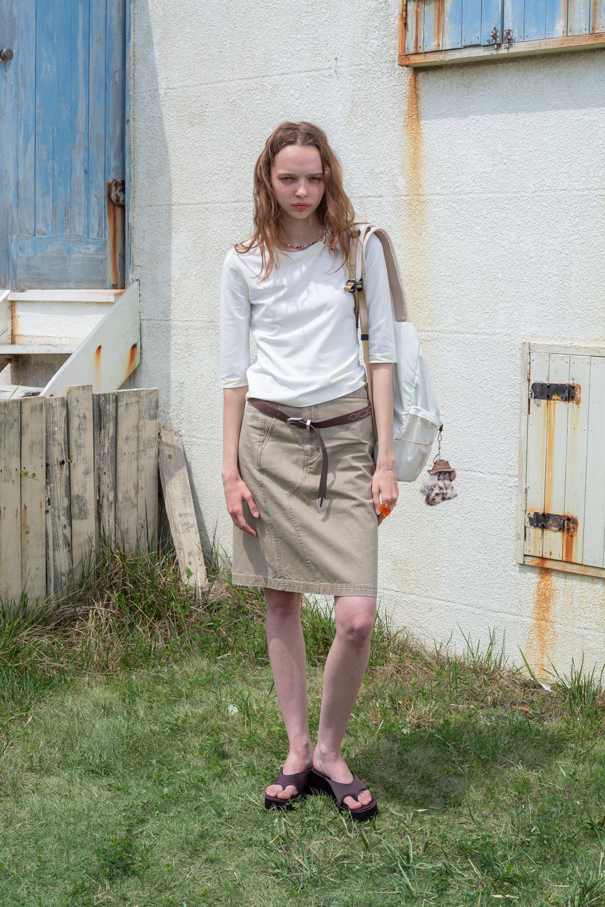 matinkim SIDE POCKET POINT MIDI SKIRT IN LIGHT KHAKI