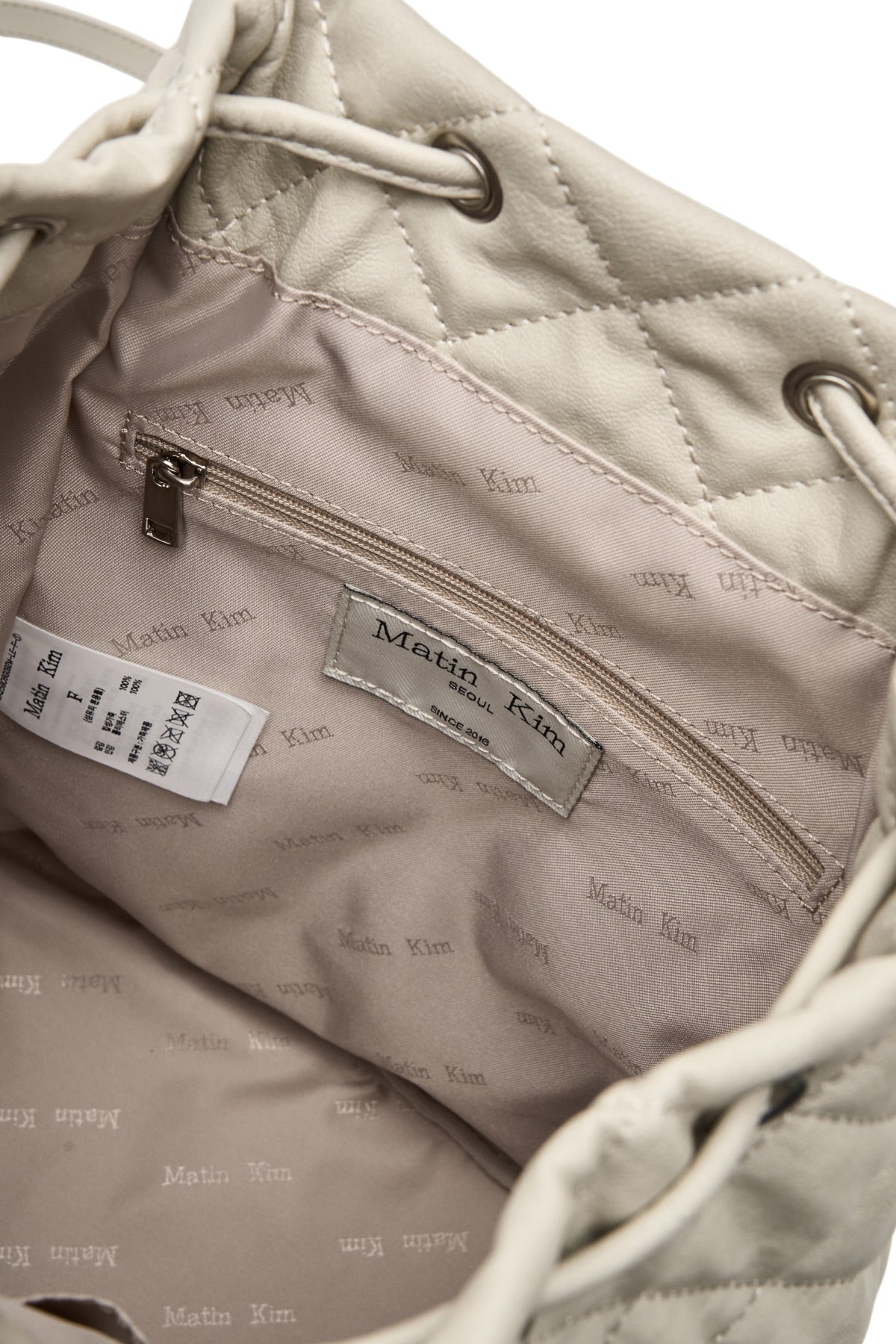 matinkim DOUBLE POCKET QUILTING BACKPACK IN LIGHT BEIGE