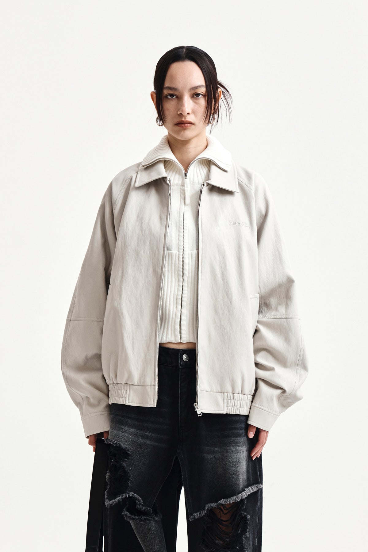 matinkim SMALL LOGO FAUX LEATHER ZIP UP JUMPER IN LIGHT GREY