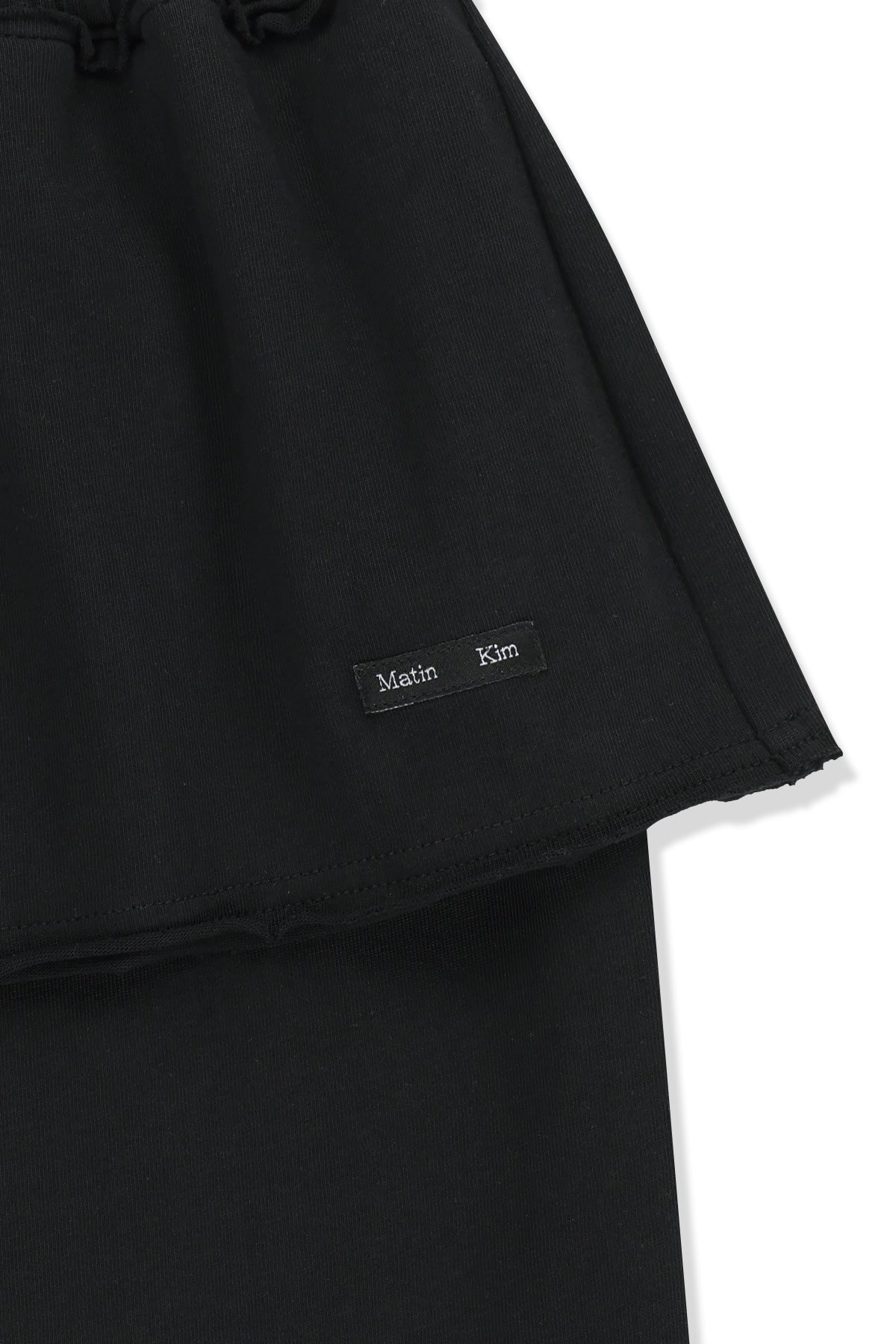 matinkim LAYERED SKIRT JERSEY PANTS IN BLACK