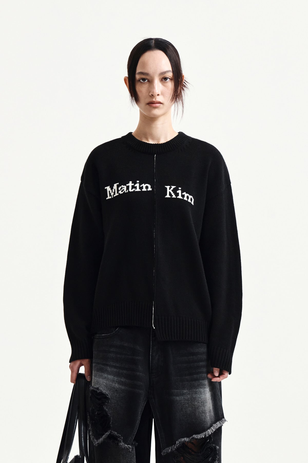 matinkim ASYMMETRIC LOGO KNIT PULLOVER IN BLACK