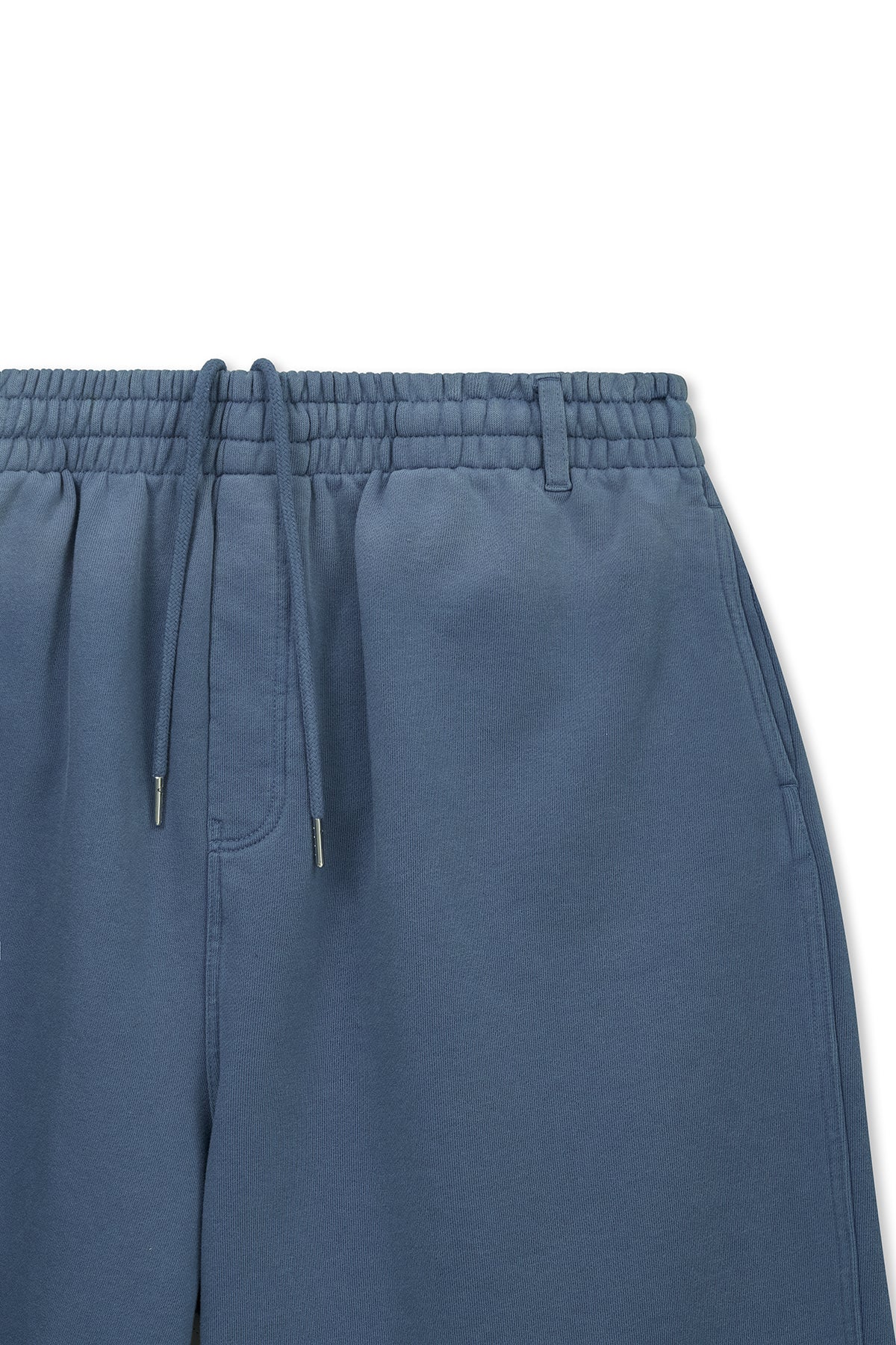 matinkim VINTAGE WASHED BACK LOGO BERMUDA SWEATPANTS IN SMOKE BLUE