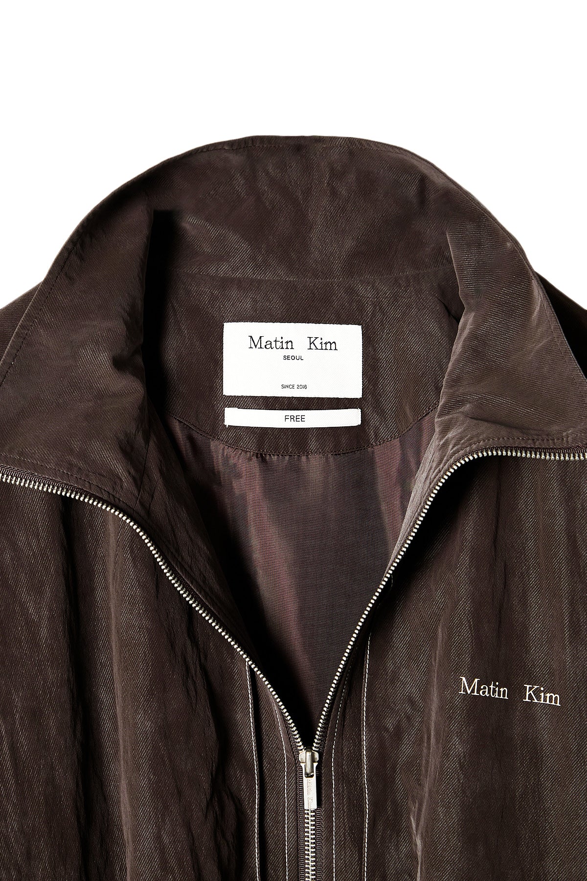 matinkim STITCH POINT HIGH NECK JUMPER IN BROWN