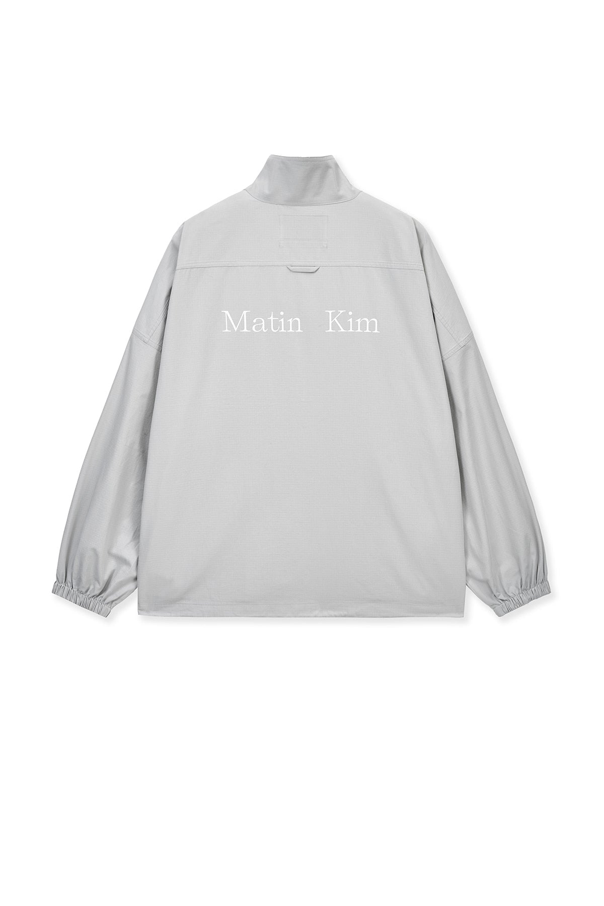 matinkim BACK LOGO HIGH NECK JUMPER IN LIGHT GREY