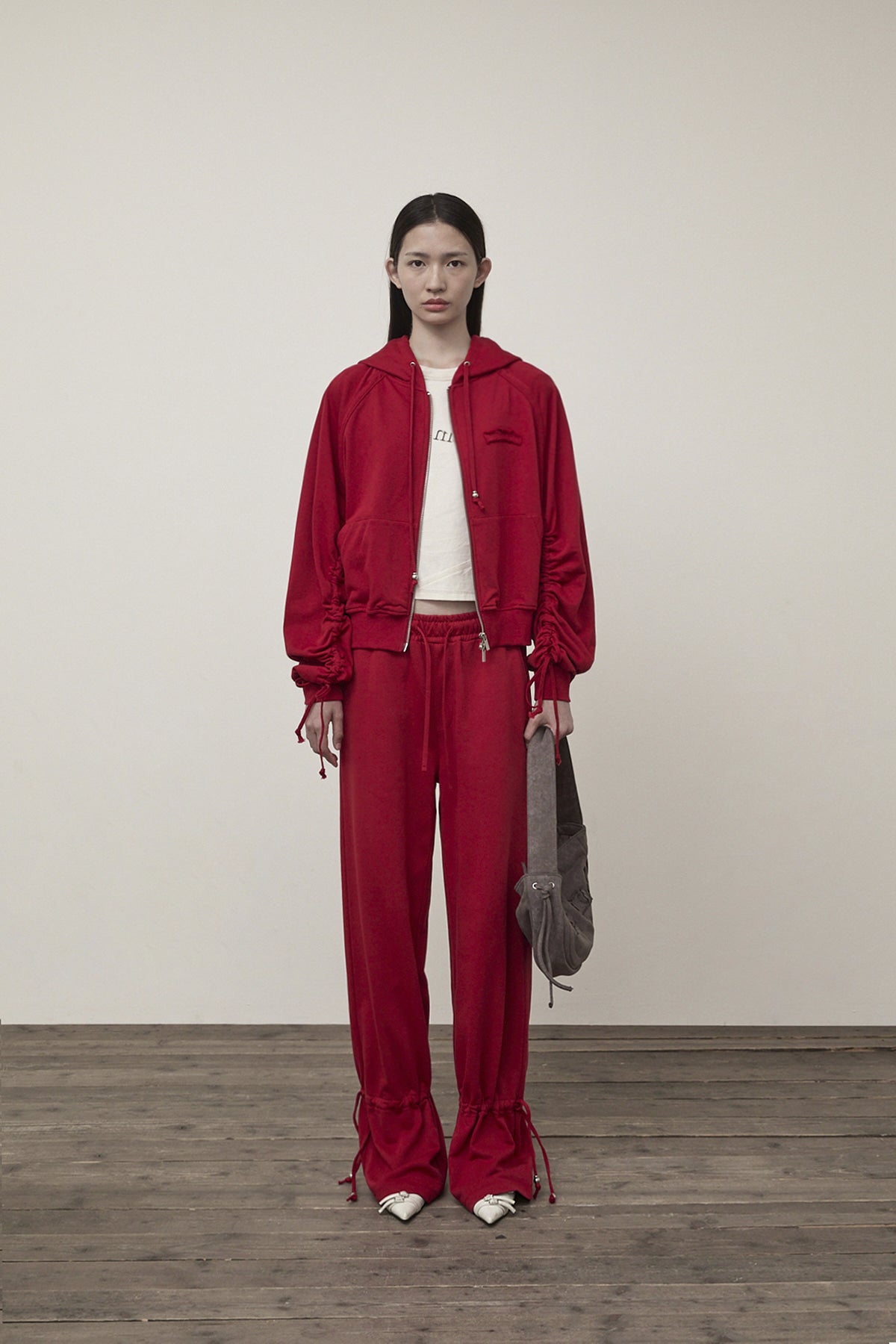 matinkim SLEEVE STRING DETAIL HOODY ZIP UP IN RED