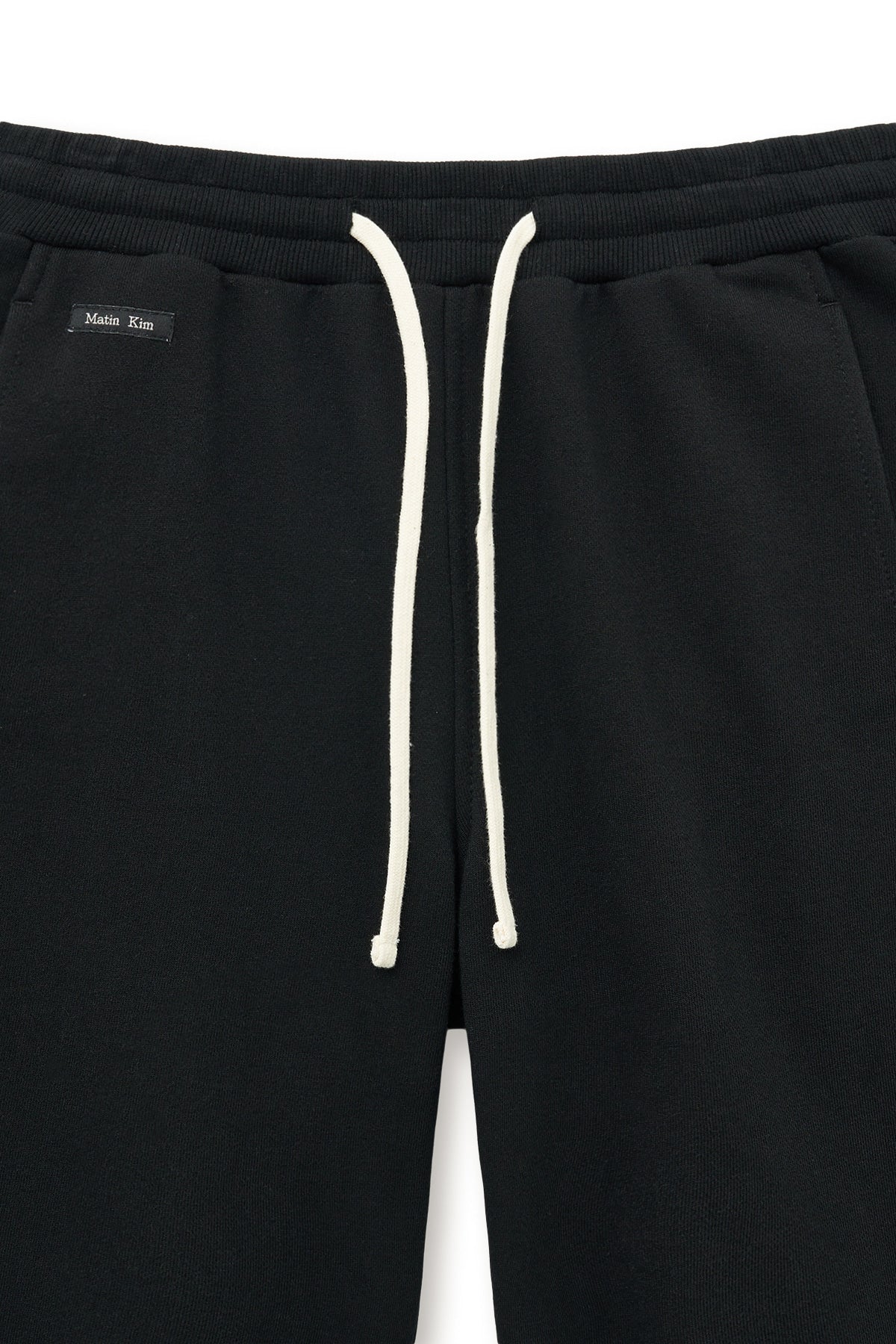 matinkim BOOTS CUT SLIM CARGO SWEATPANTS IN BLACK