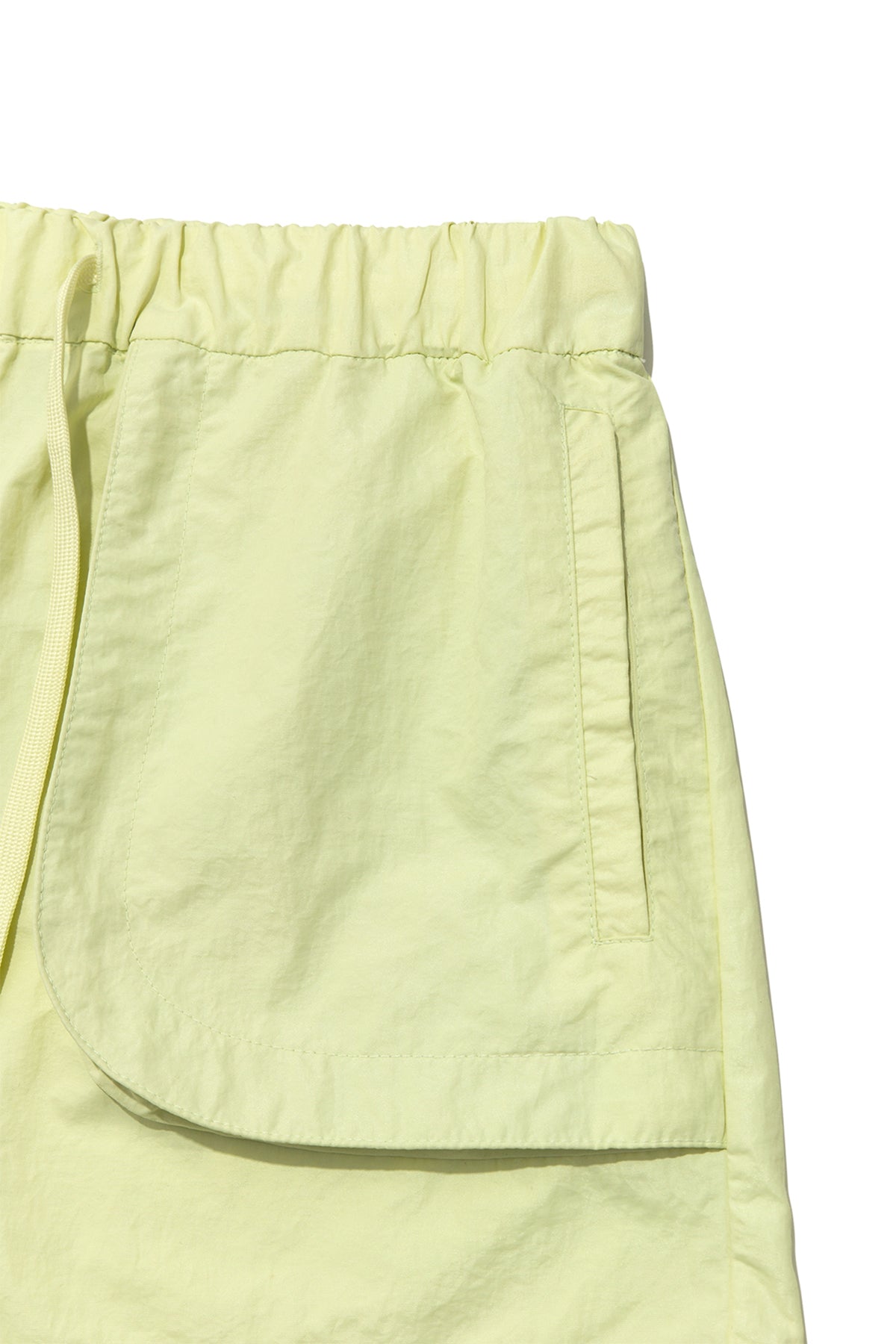 matinkim OUT POCKET NYLON BANDING SHORTS IN LIME
