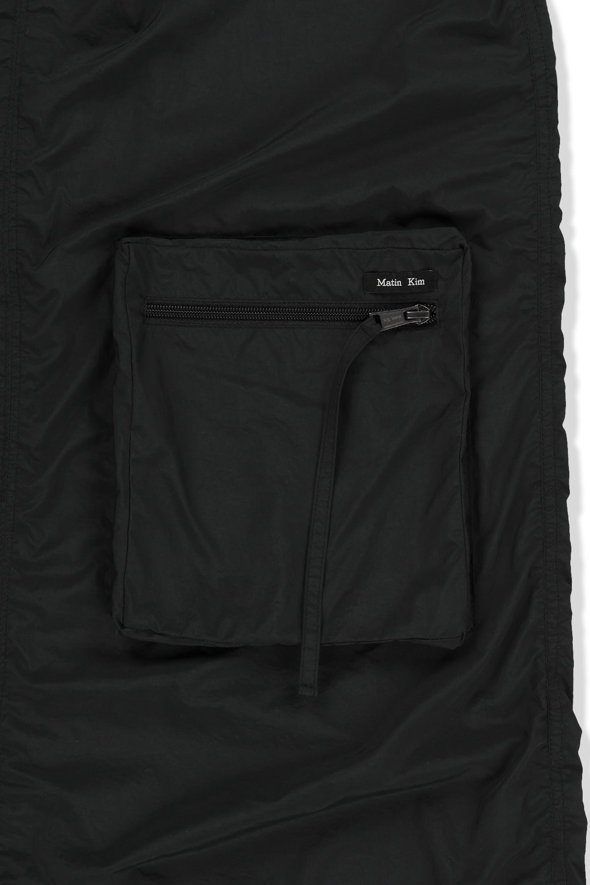 matinkim PATCH POCKET SHIRRING NYLON SKIRT IN BLACK