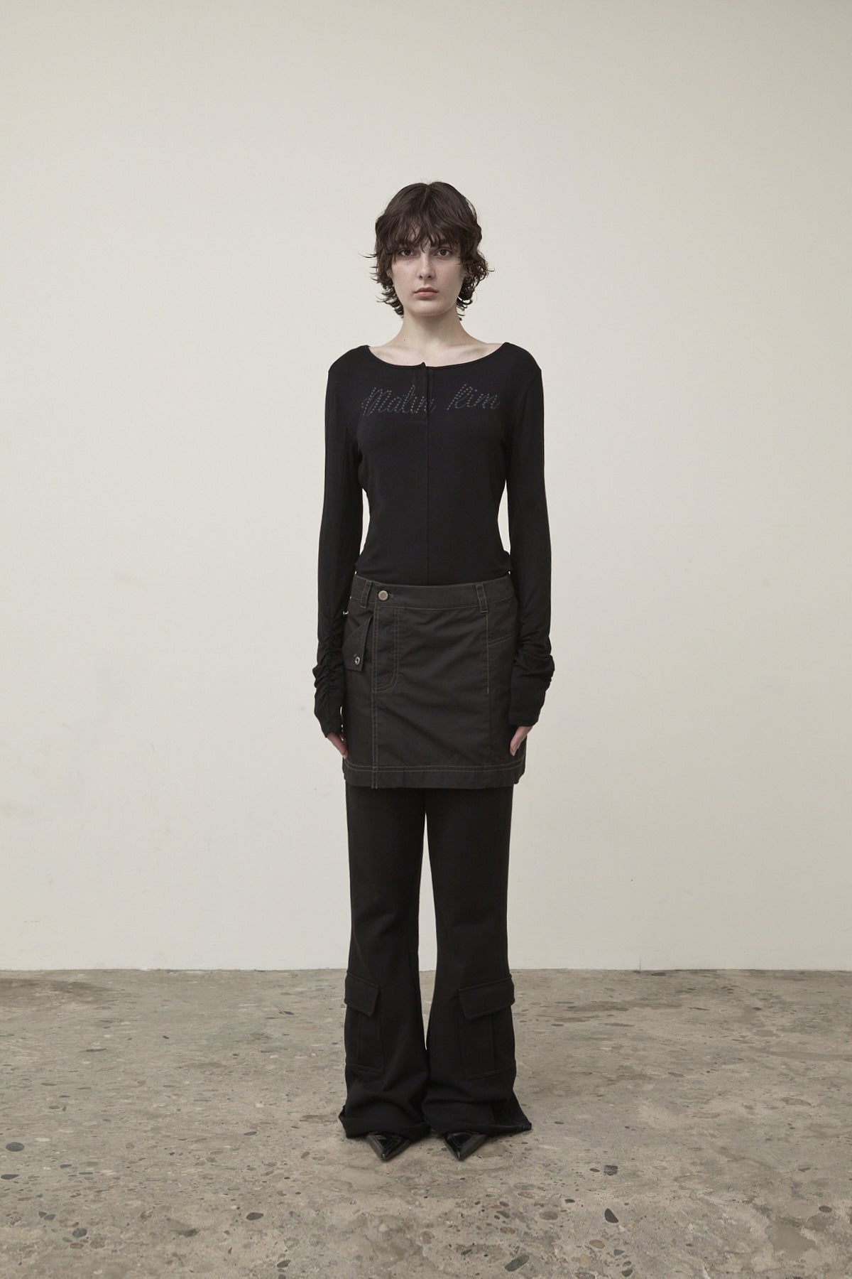 matinkim POCKET FOLDOVER WRAP MINI SKIRT IN BLACK
