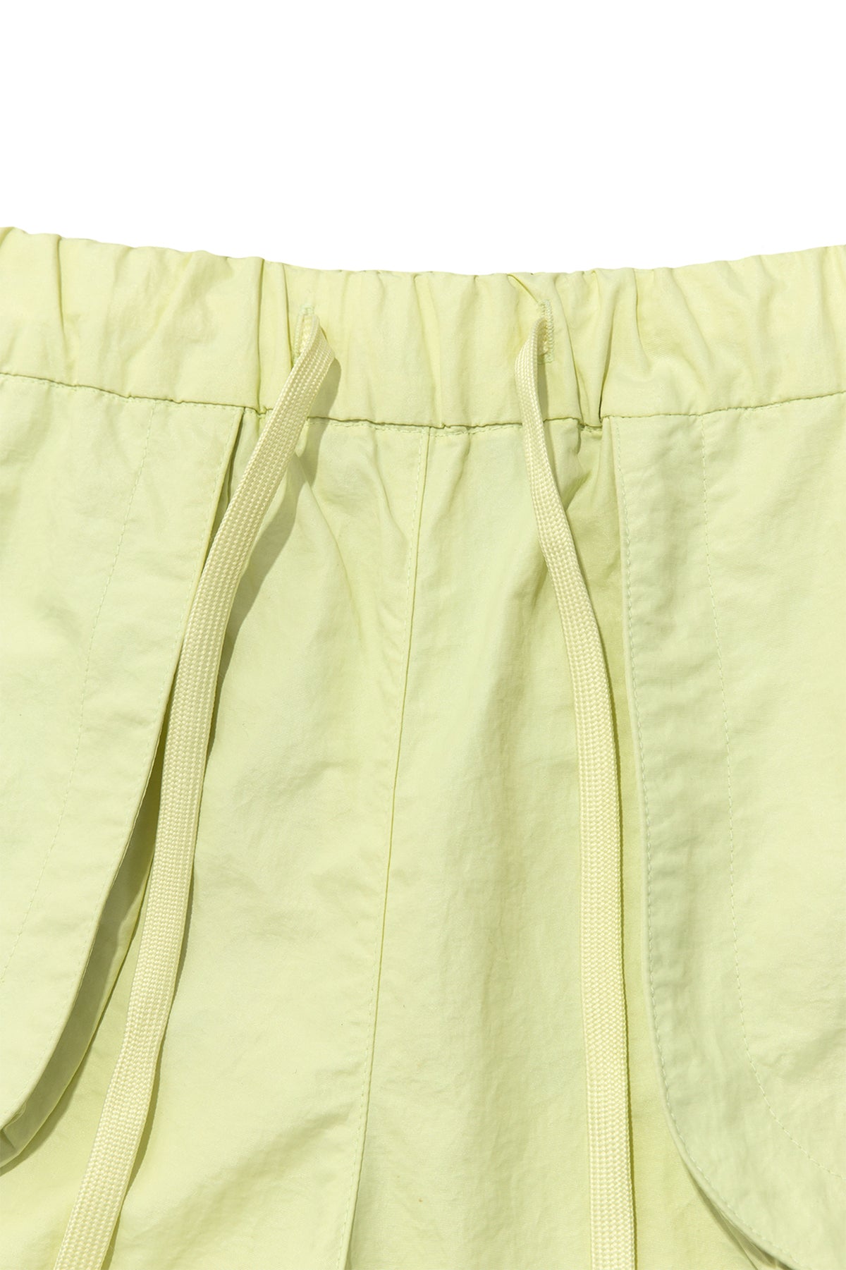 matinkim OUT POCKET NYLON BANDING SHORTS IN LIME