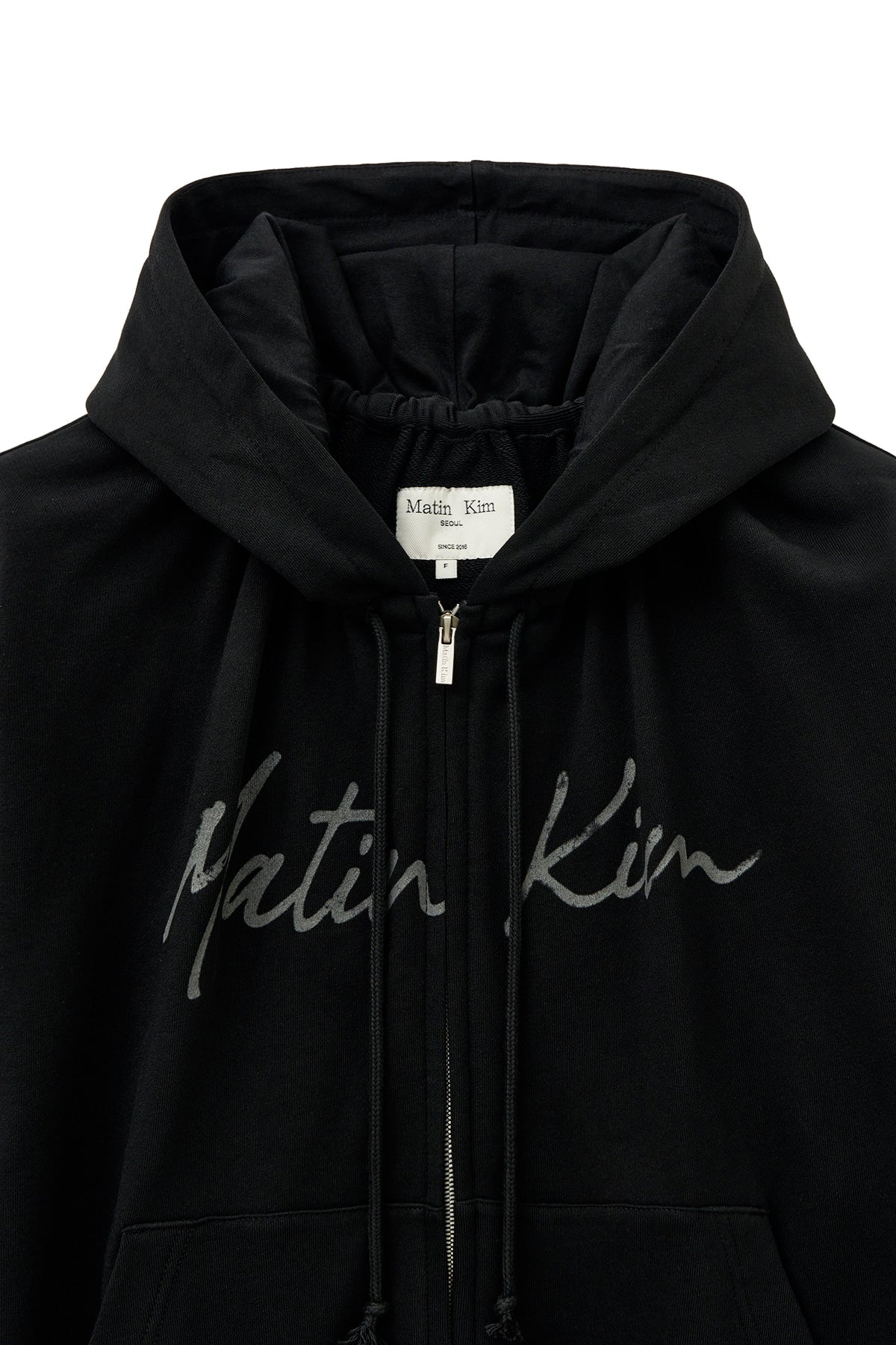 matinkim DRAWSTRING POINT ZIP UP HOODY IN BLACK