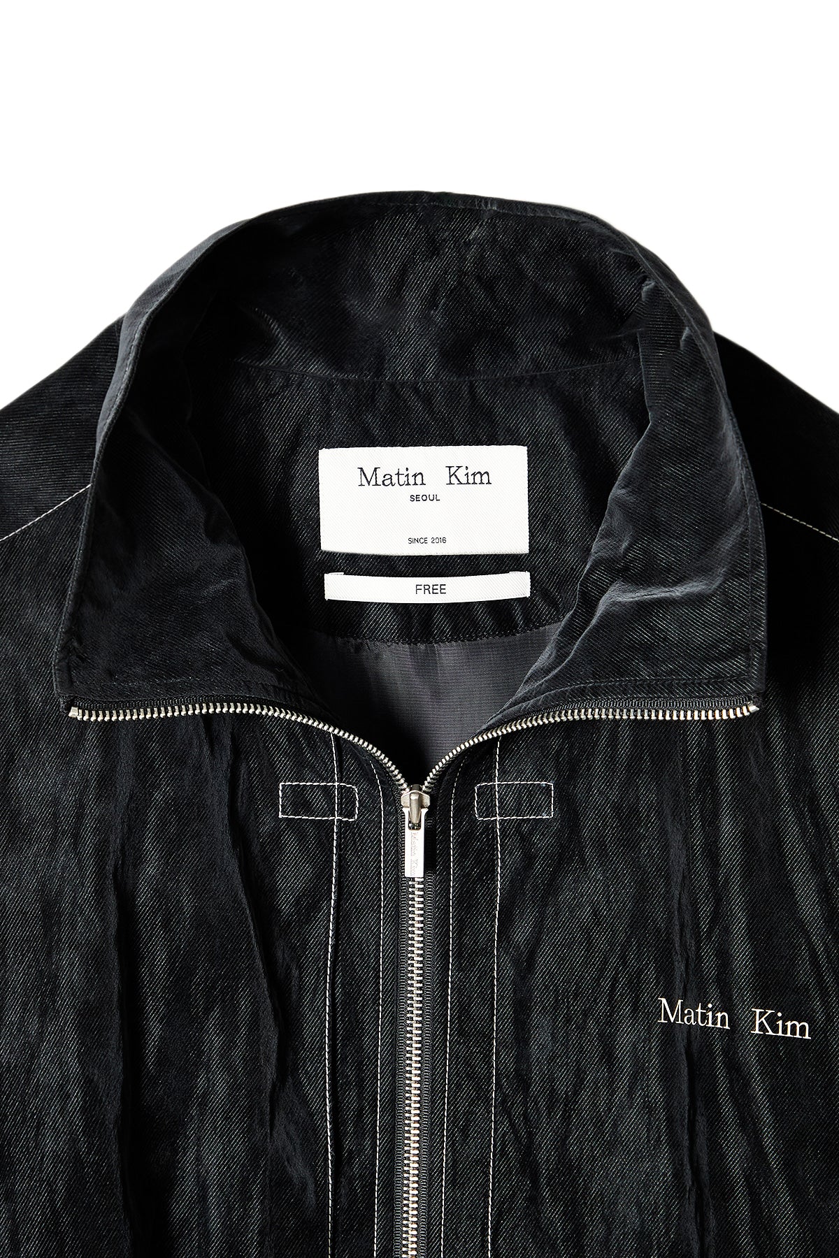 matinkim STITCH POINT HIGH NECK JUMPER IN BLACK