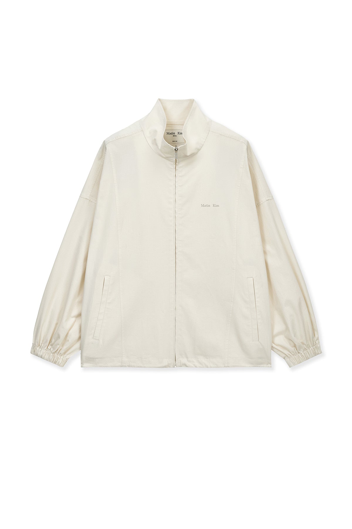 matinkim BACK LOGO HIGH NECK JUMPER IN CREAM