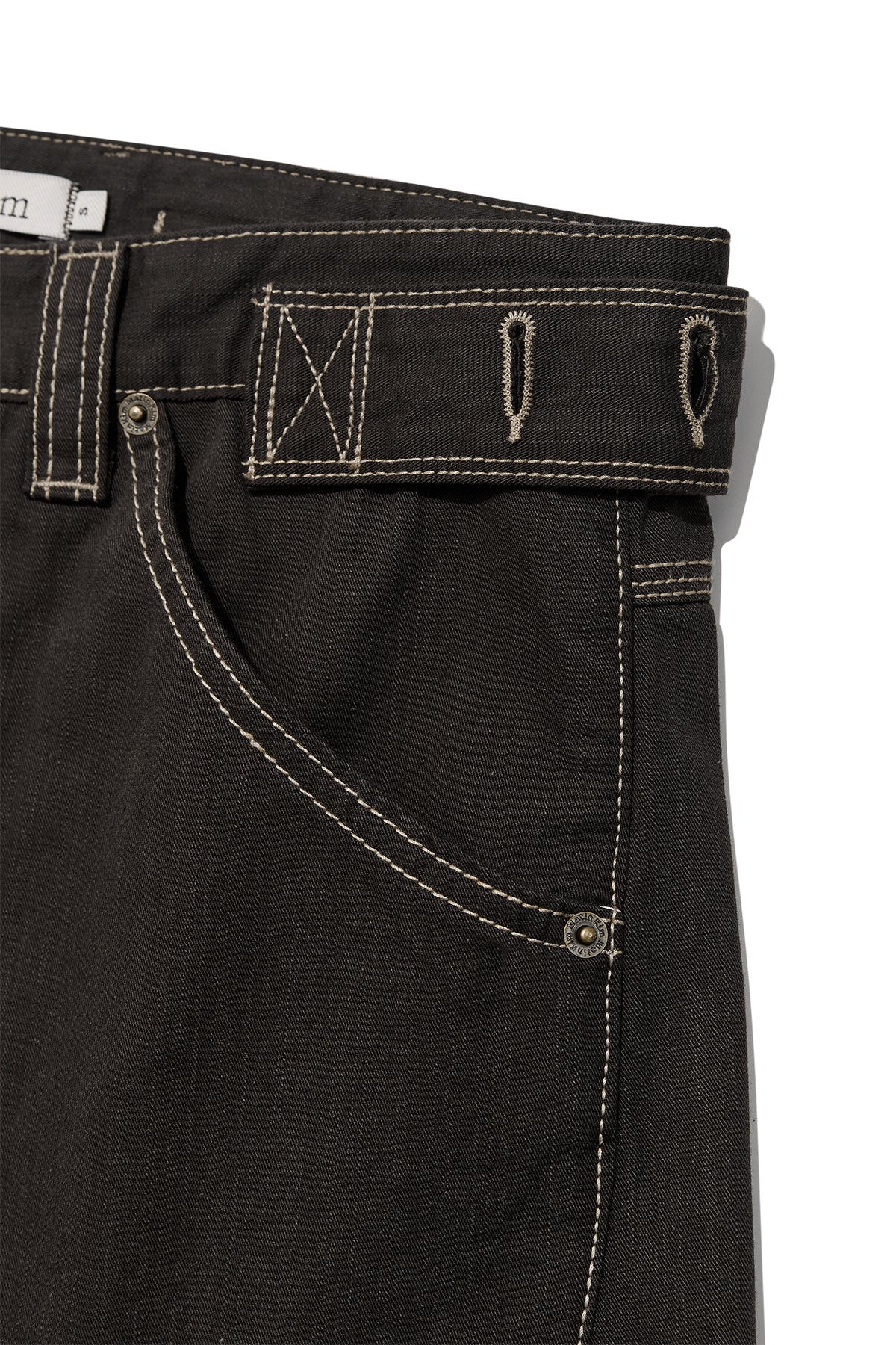 matinkim WAIST BUCKLE CURVED TWILL DENIM PANTS IN CHARCOAL