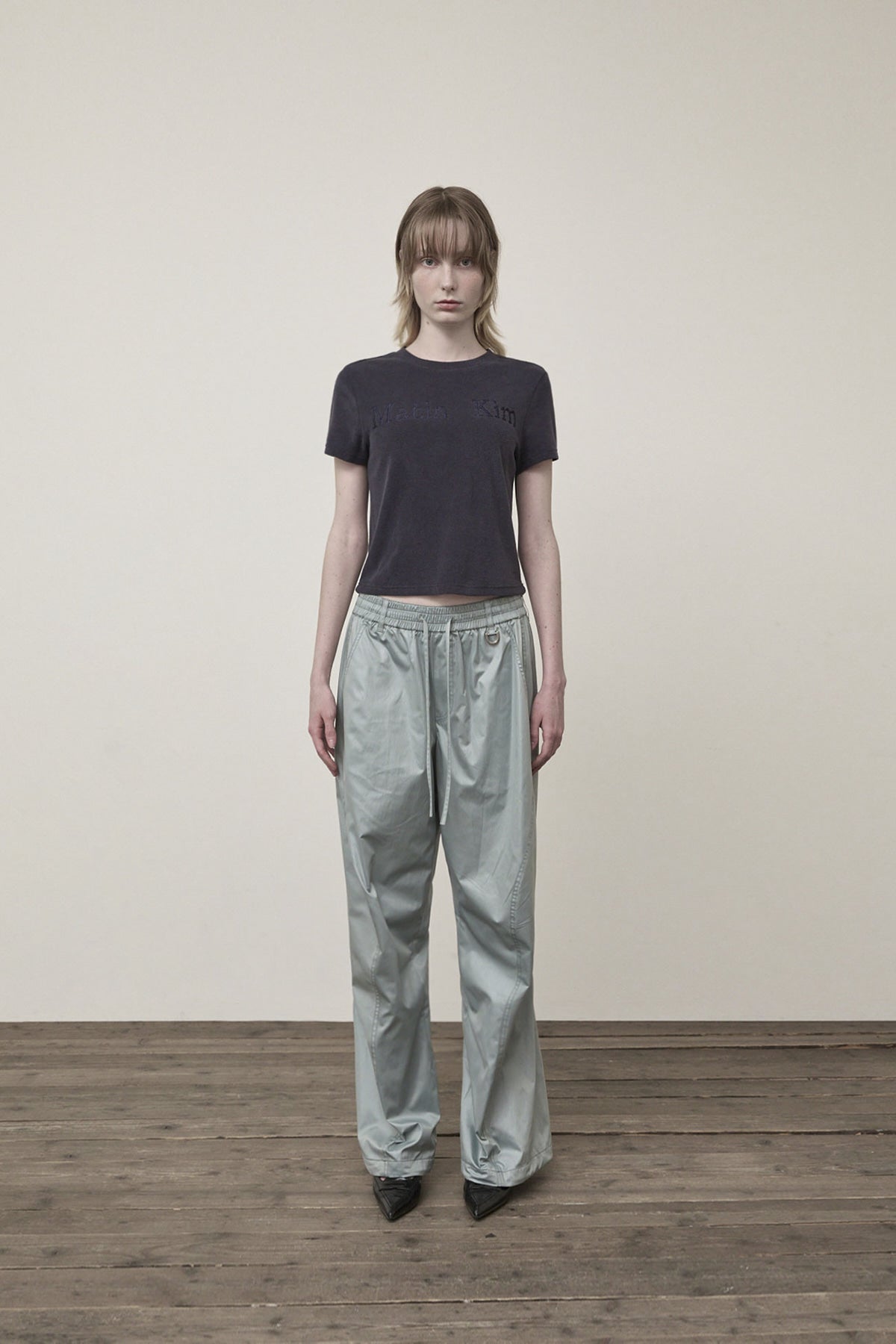 matinkim GLOSSY BANDING TRACK PANTS IN MINT