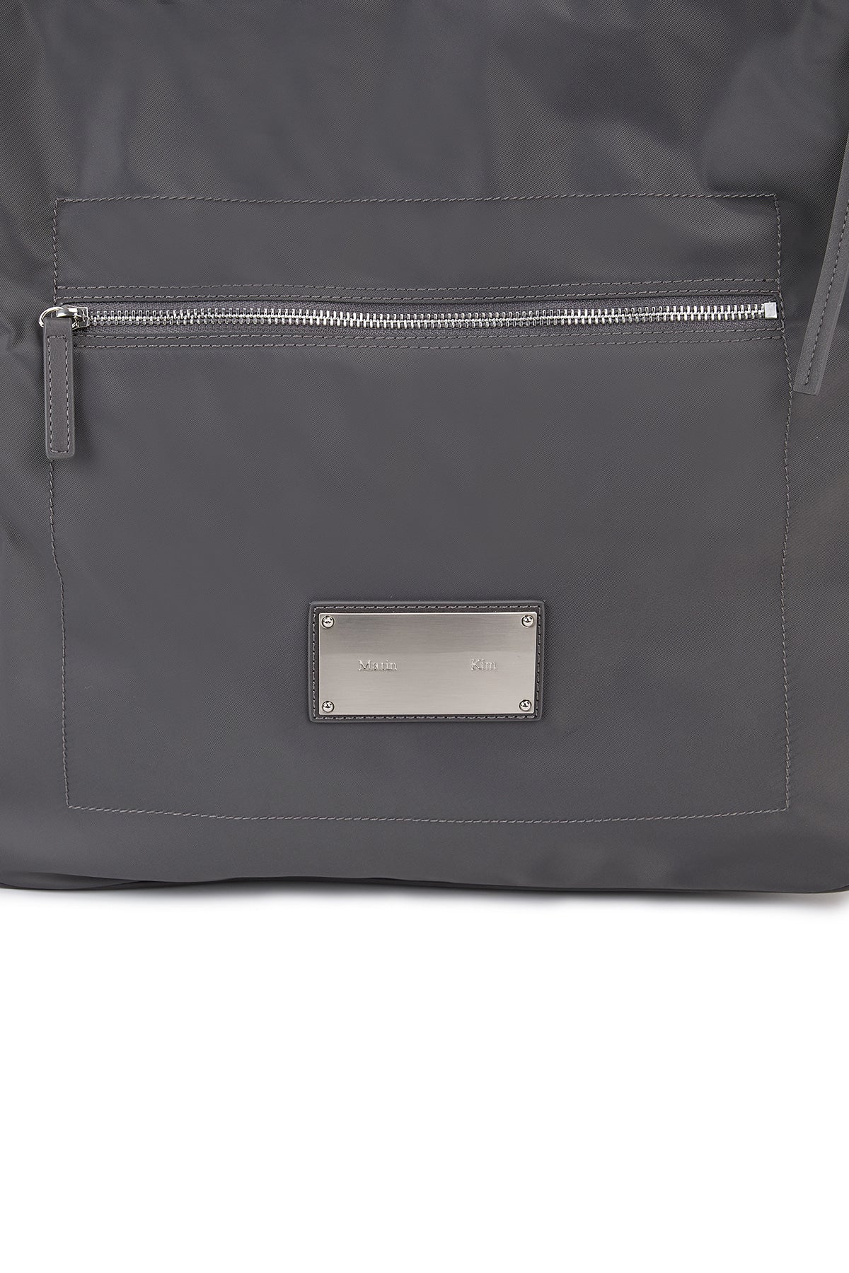 matinkim EMBOSSED LOGO FABRIC SHOULDER BAG IN CHARCOAL