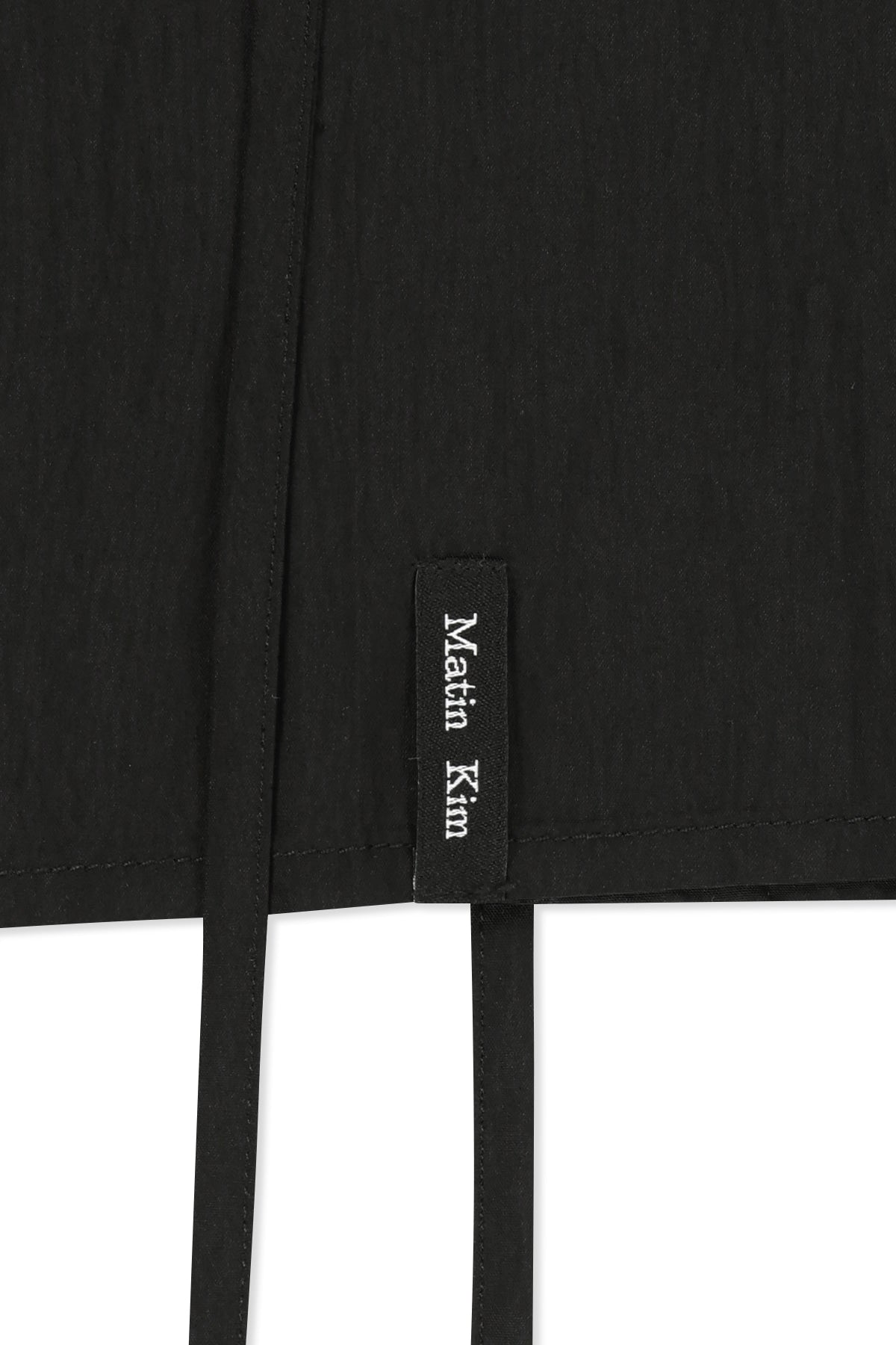 matinkim BUTTON SLEEVELESS BLOUSE IN BLACK