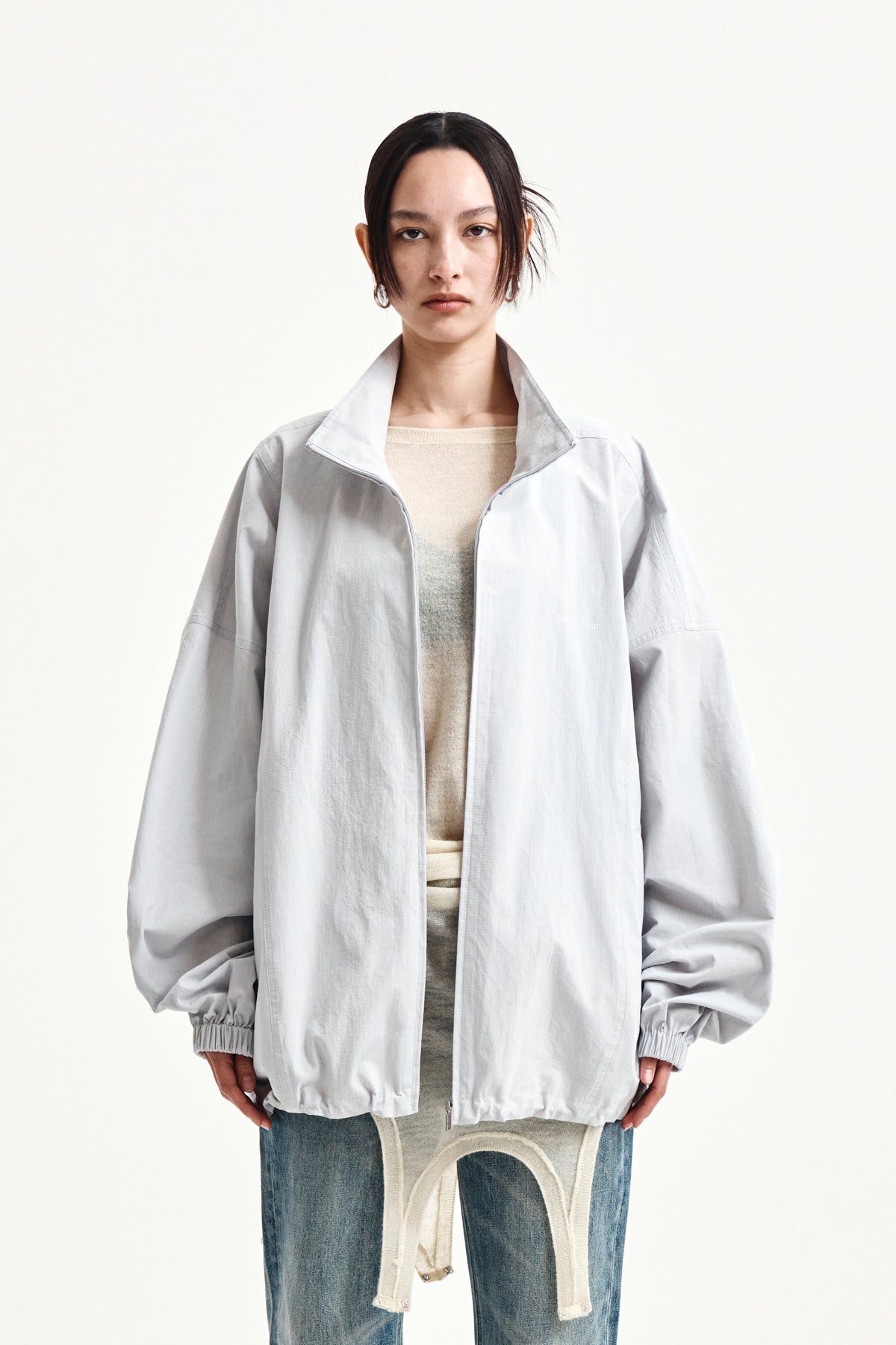 matinkim BACK LOGO HIGH NECK JUMPER IN LIGHT GREY