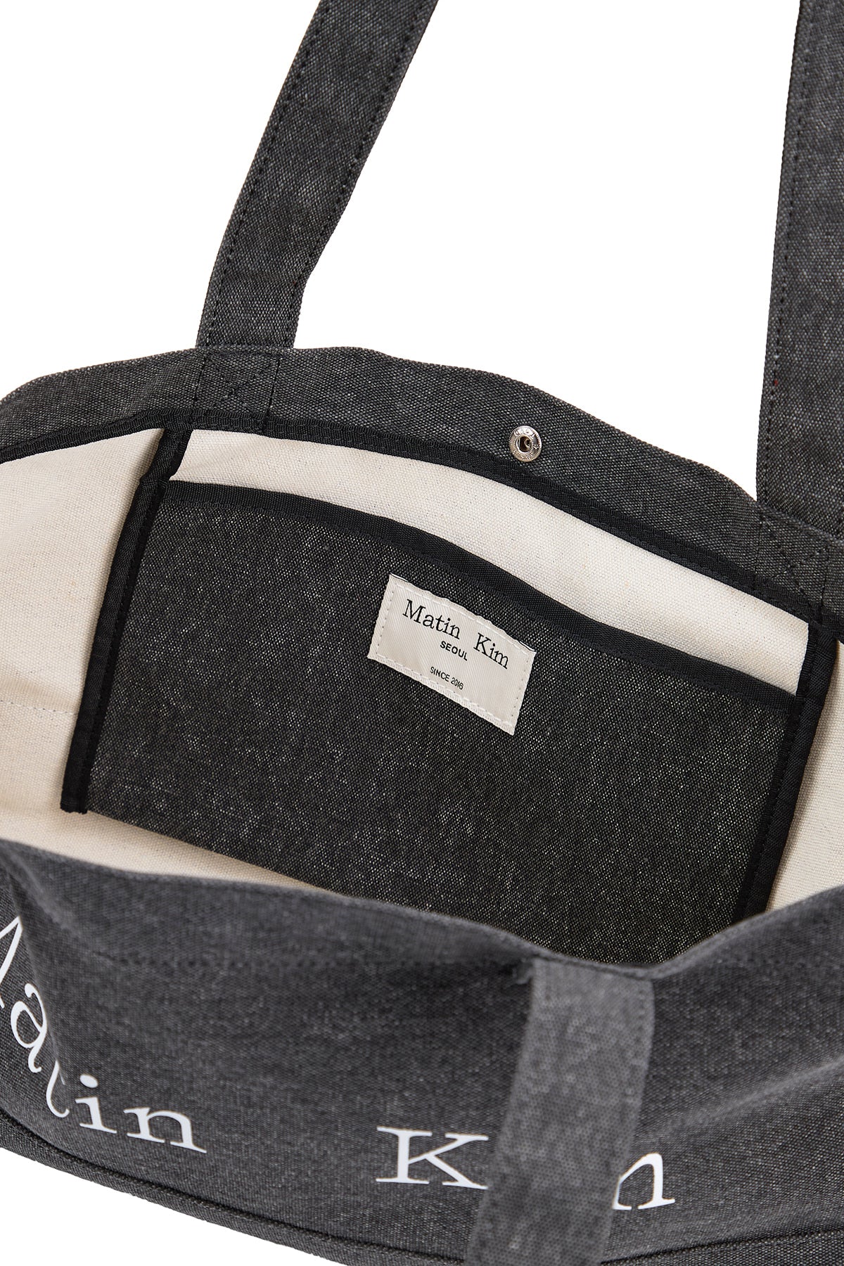 matinkim MATIN LOGO CANVAS WIDE SHOULDER BAG IN CHARCOAL