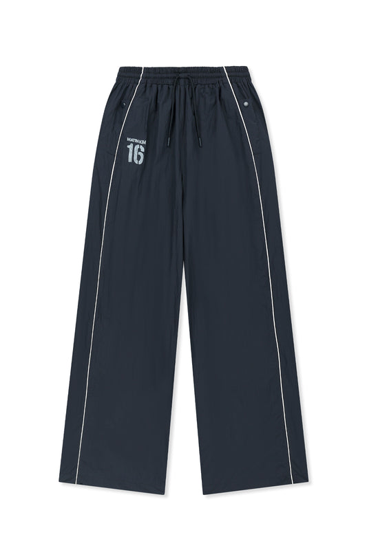 matinkim MATIN 16 LOGO TRACK PANTS IN NAVY