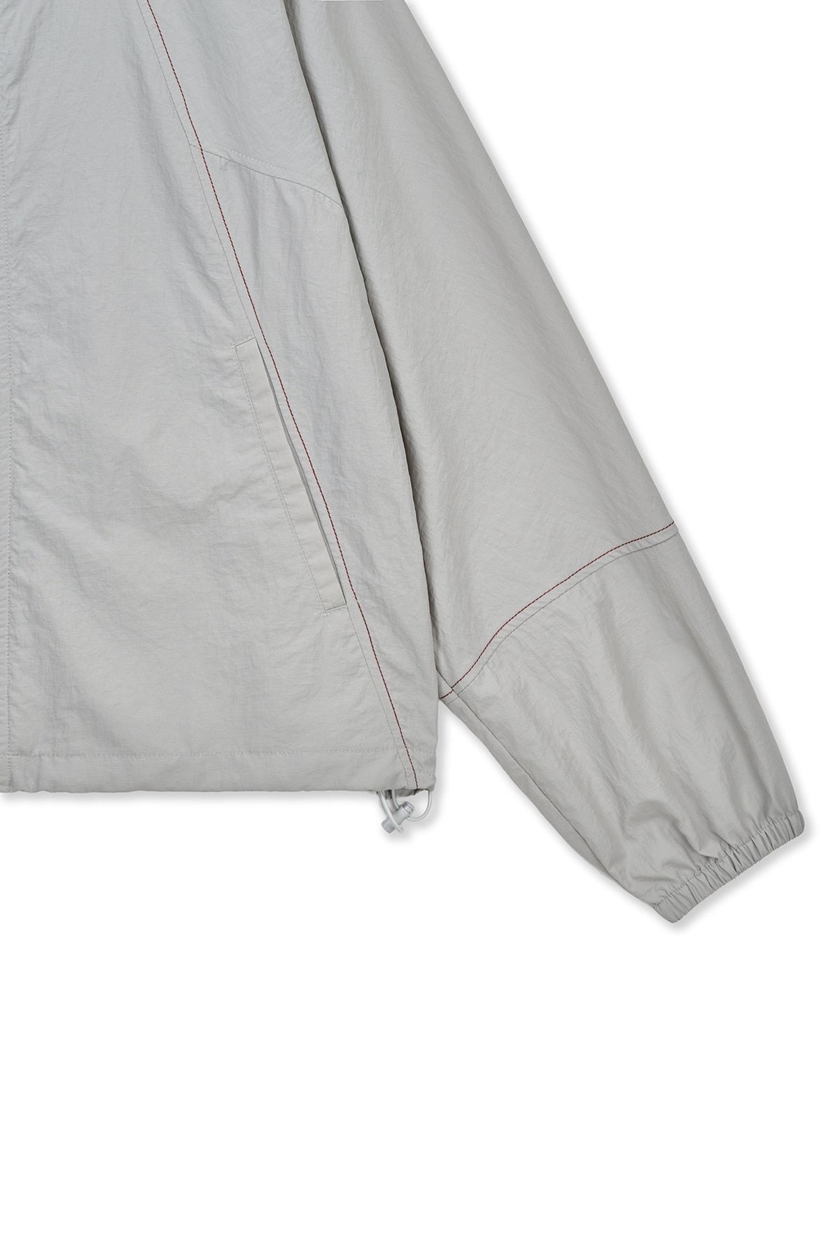 matinkim CROPPED BACK LOGO HOODY WIND BREAKER IN LIGHT BEIGE