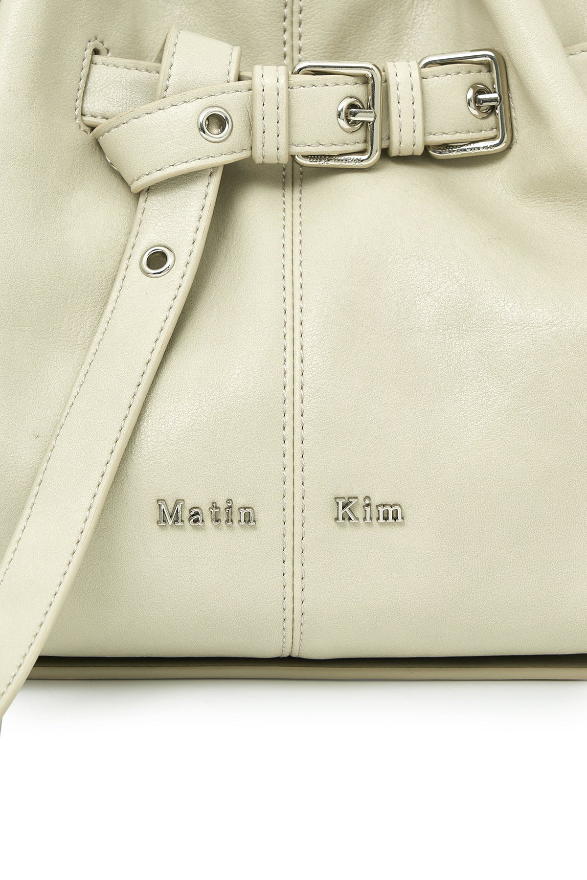 matinkim BELTED VOLUNN SMALL BUCKET BAG IN IVORY