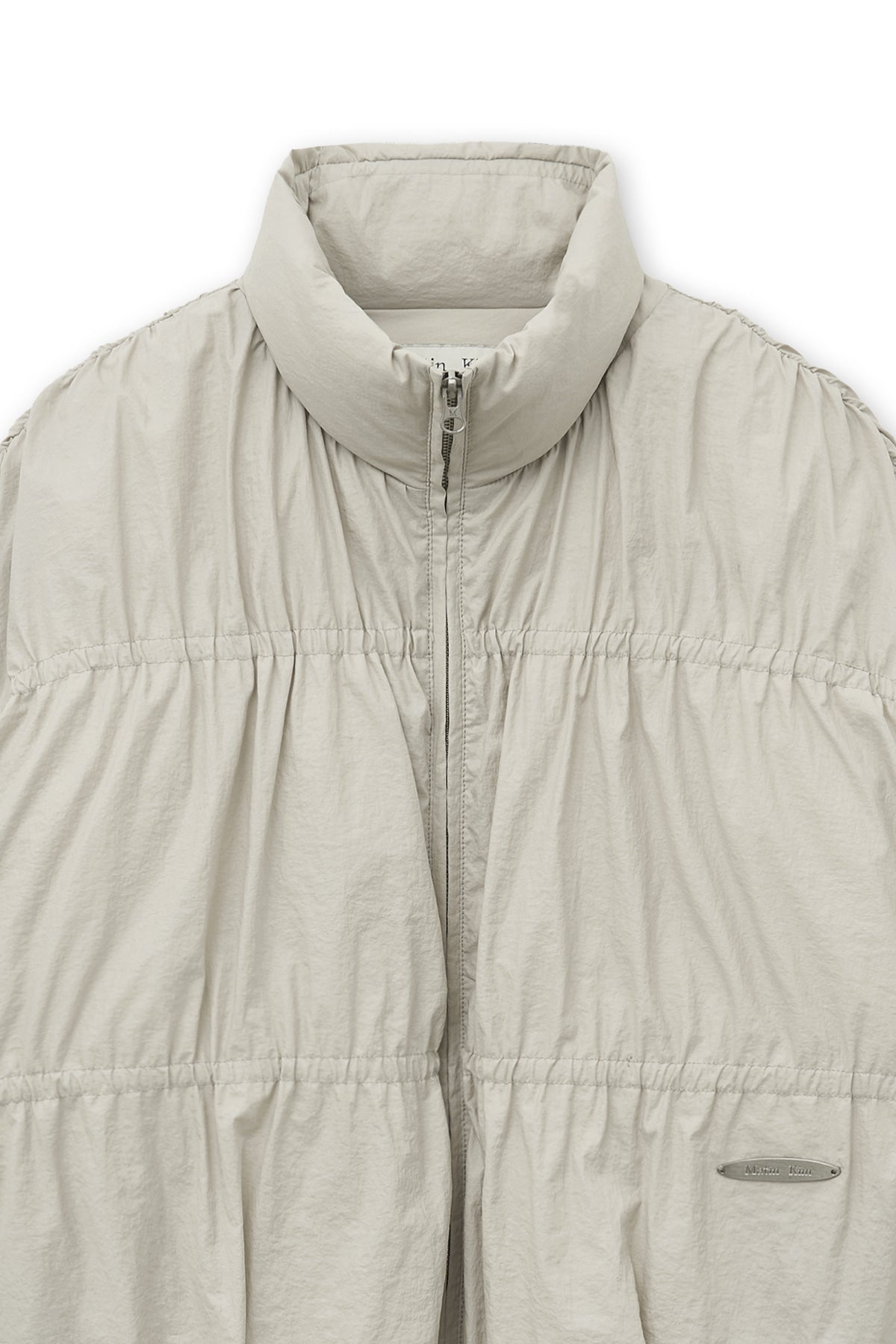 matinkim HIGH NECK SHIRRING DOWN JUMPER IN LIGHT BEIGE