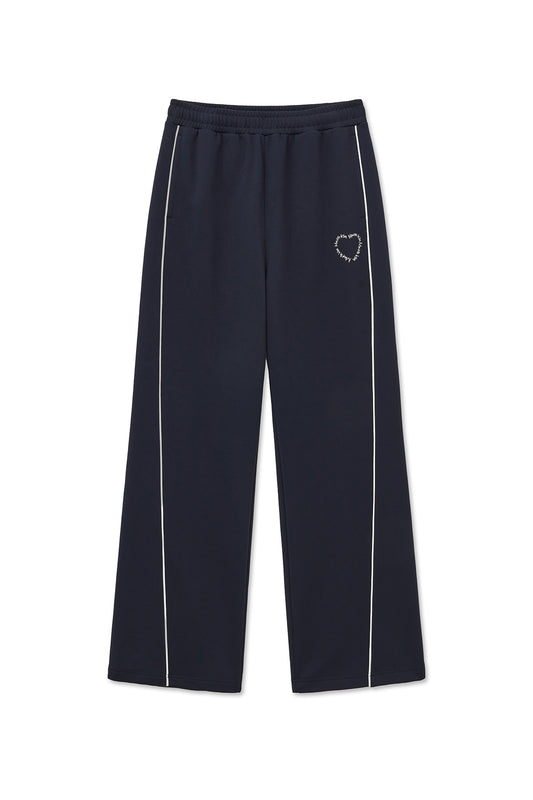 matinkim HEART LOGO TRACK PANTS IN NAVY