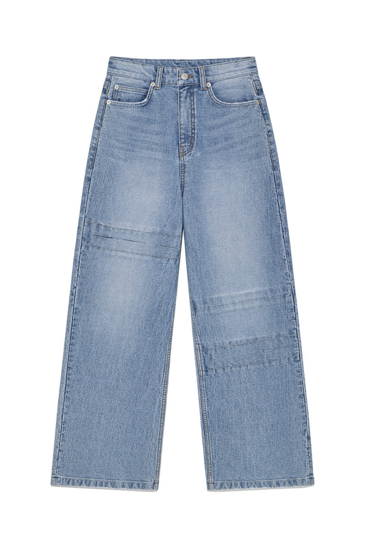 matinkim UNBALANCE CUT POINT DENIM PANTS IN BLUE