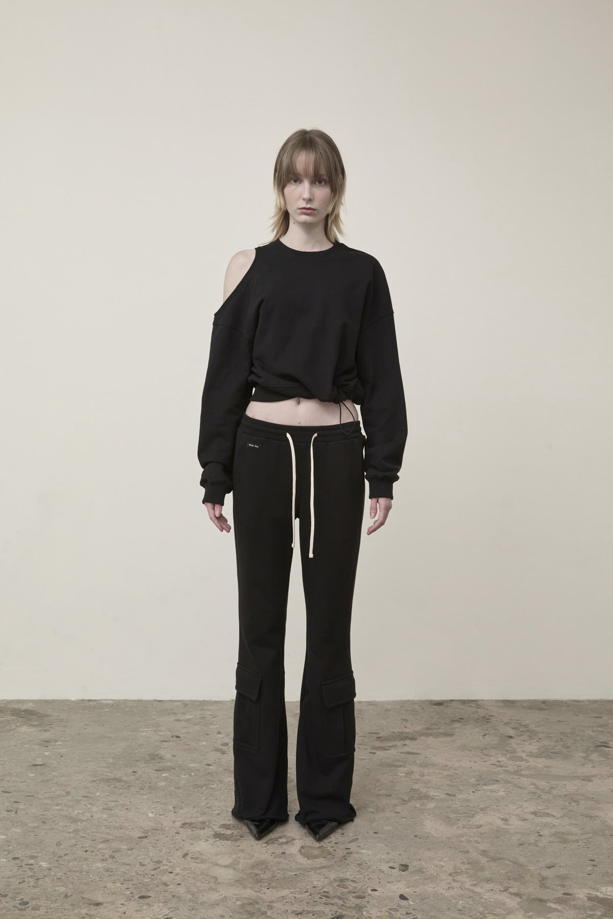 matinkim BOOTS CUT SLIM CARGO SWEATPANTS IN BLACK