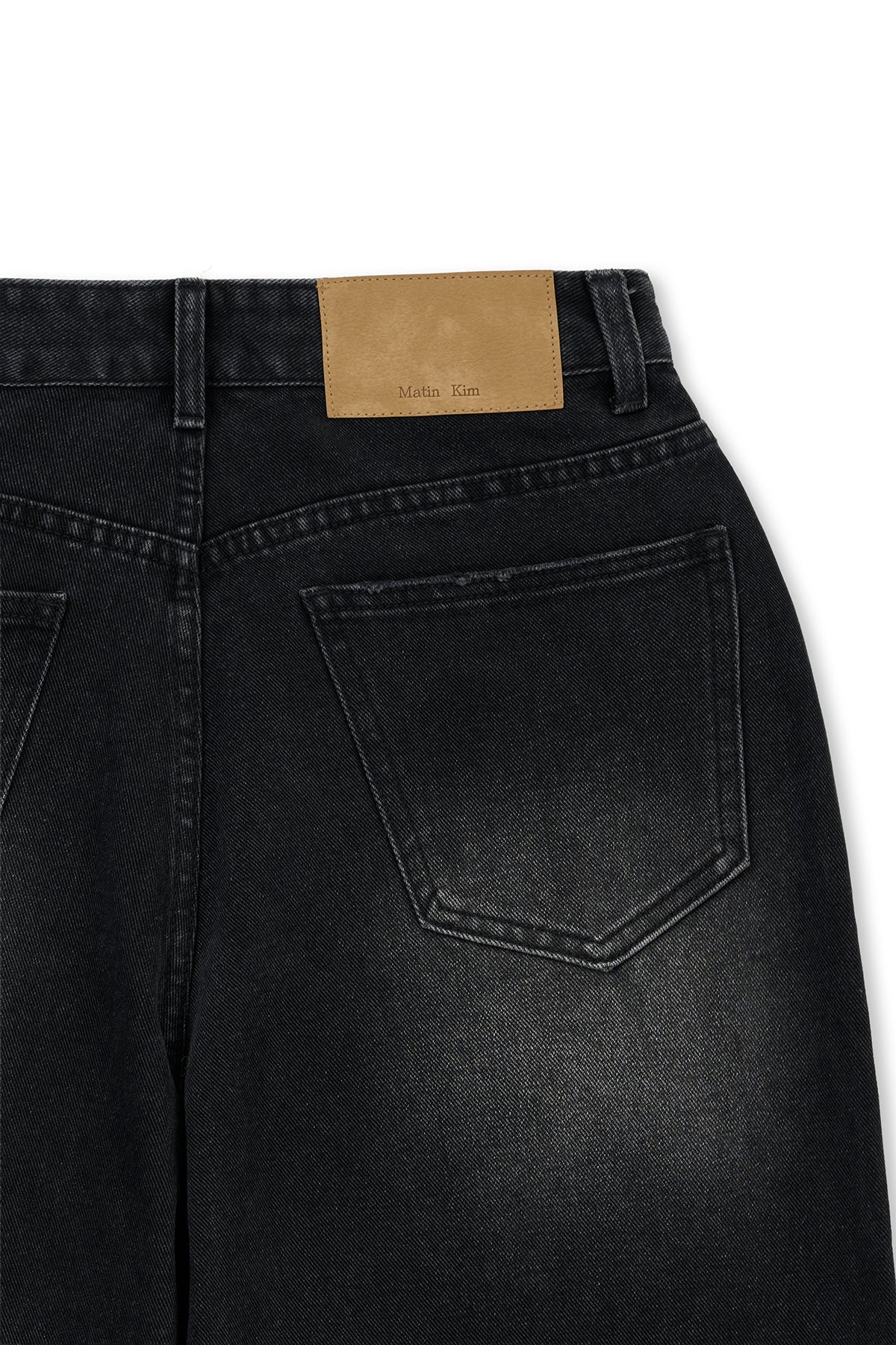 matinkim FRONT LAYERED DISTRESSED DENIM PANTS IN BLACK