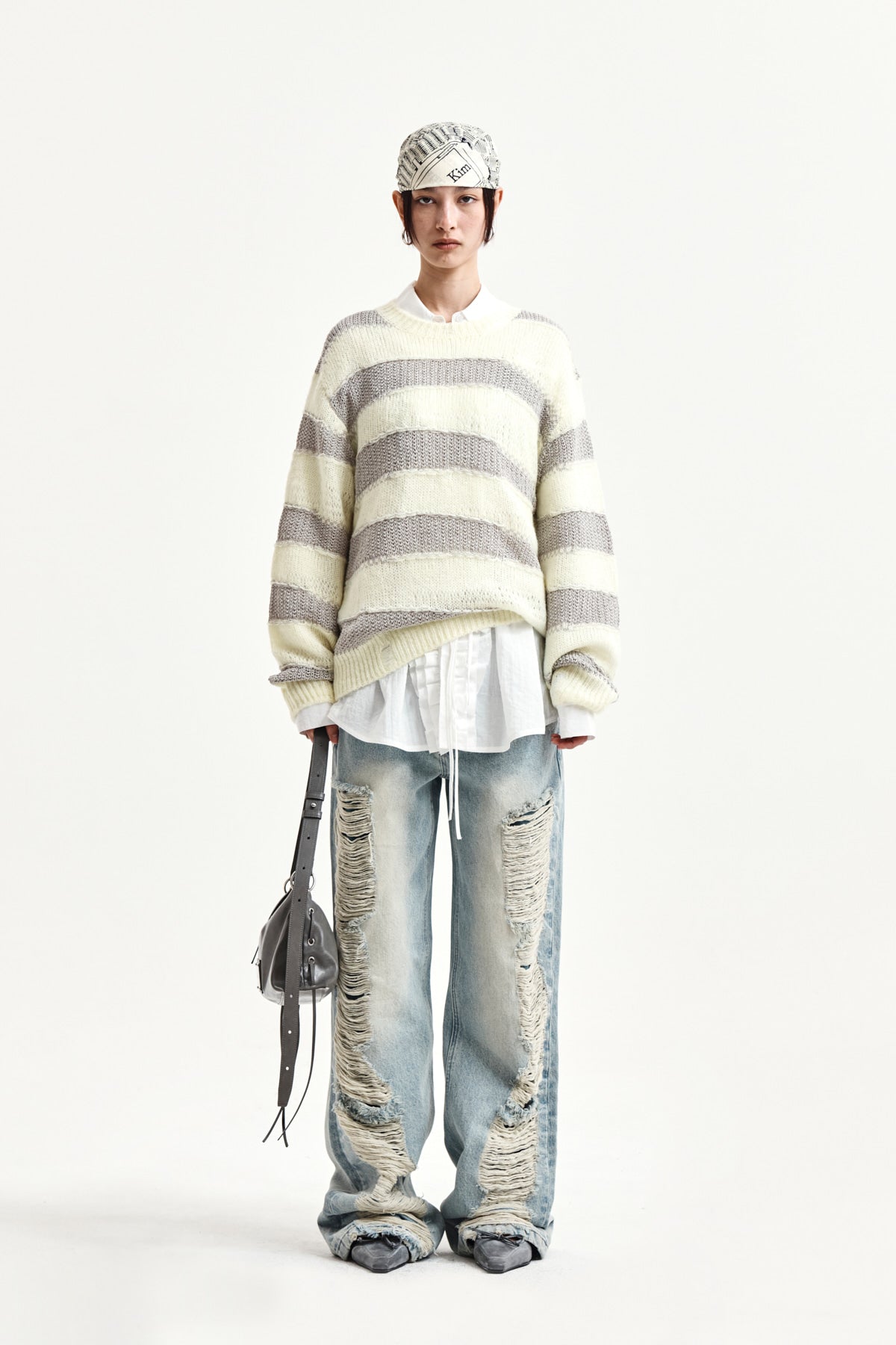 matinkim HEAVY DESTROYED DENIM PANTS IN LIGHT BLUE